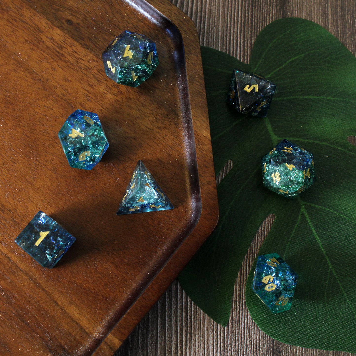 Shattered Glass Dice Set reflecting light like sea currents, perfect for tabletop RPGs.