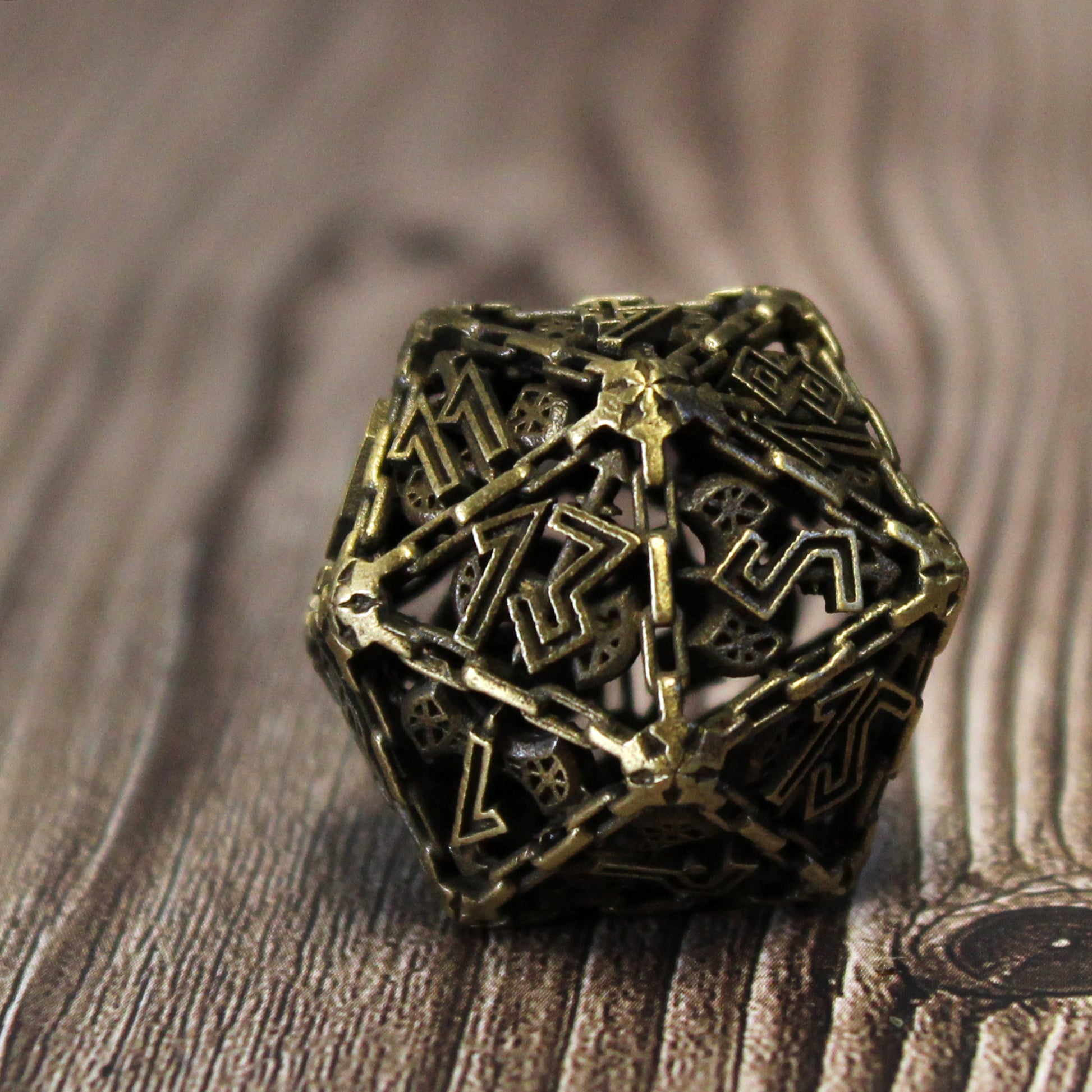 Close-up of the bronze Barbarian Cage D20, perfect for dnd games.
