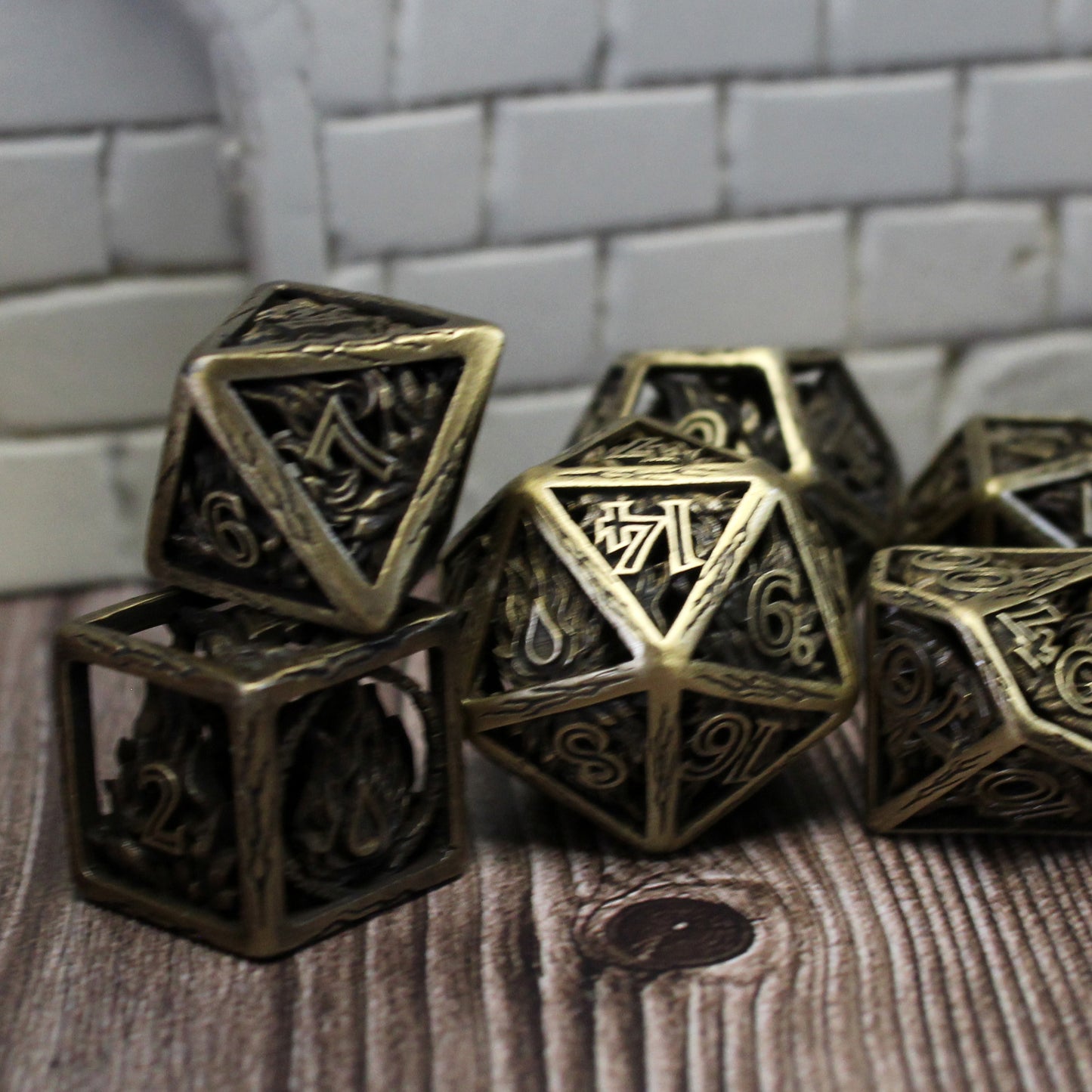 6 dice scattered on wood paneled surface with white tiles behind them
