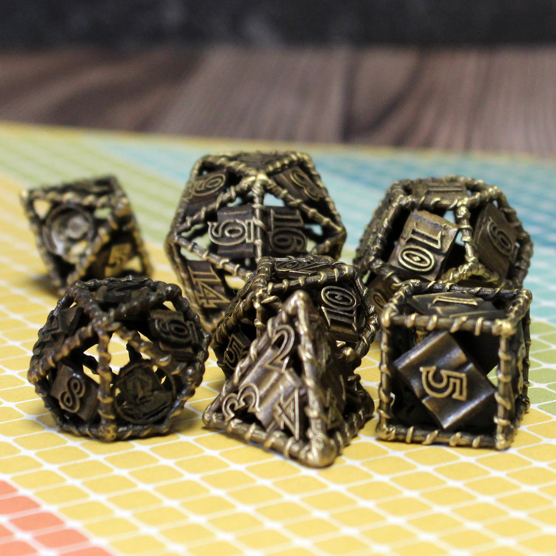 all 7 bronze dice on a yellow tiled surface