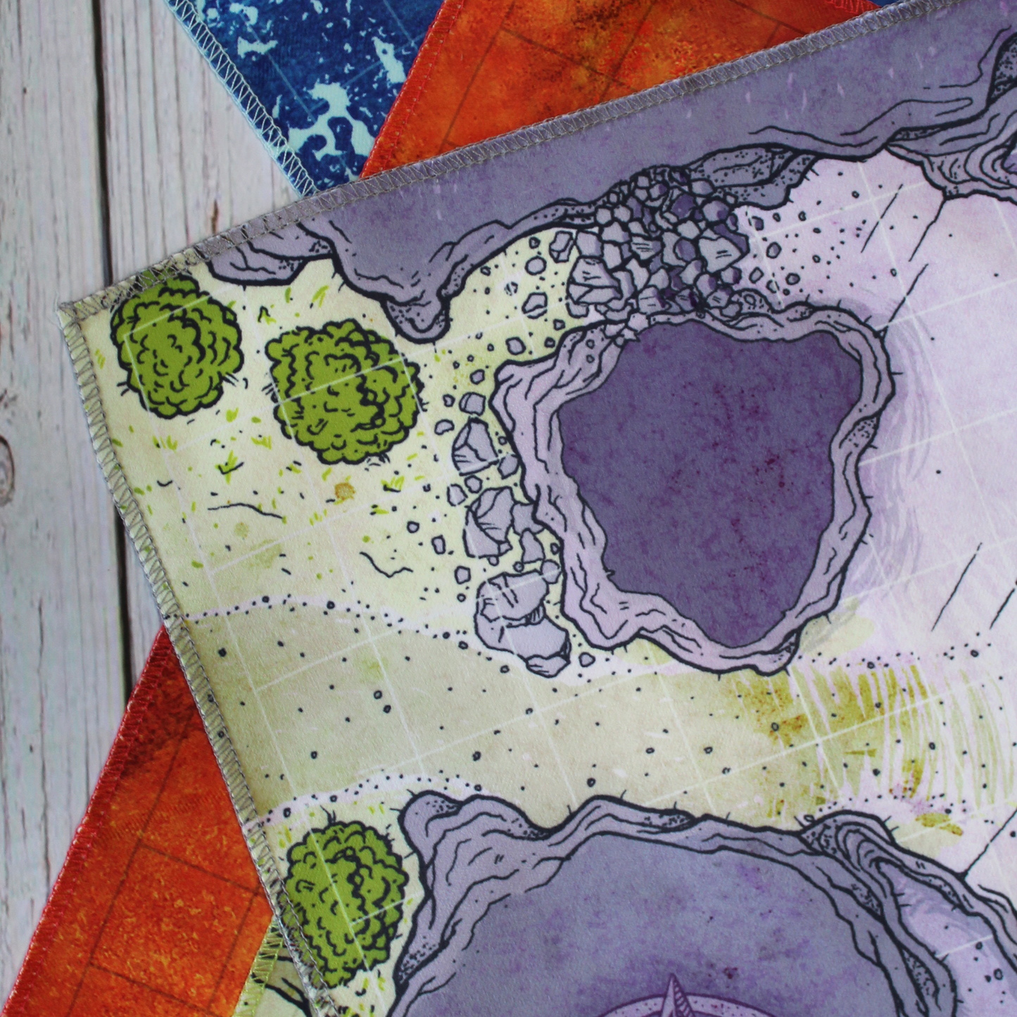 Closeup photo of the corner of a cave battle map showing edge stitching