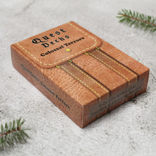 Quest Deck: Colossal Terrors  containing 45 quest prompts for hunting massive, legendary creatures in RPG adventures.