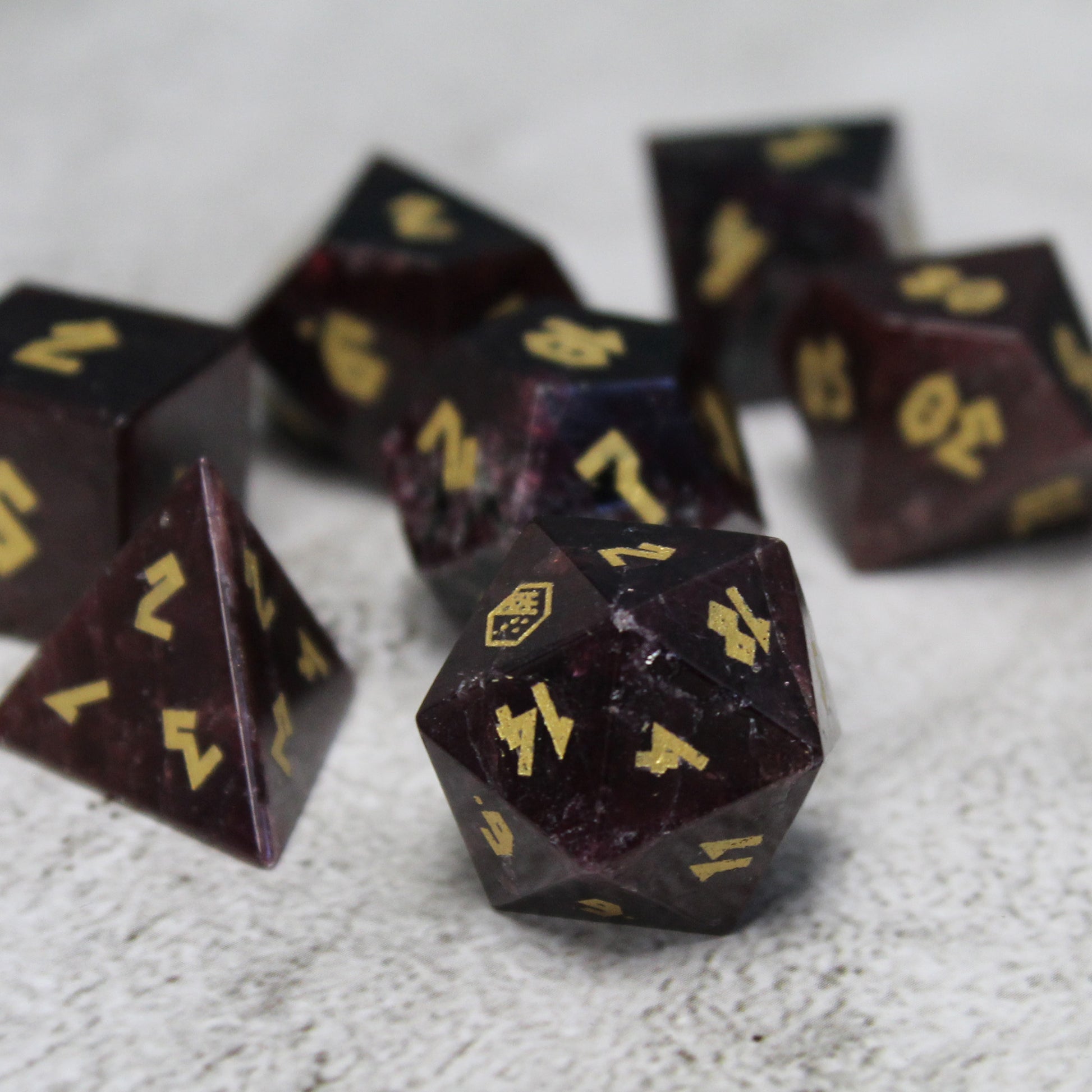 Close-up of Garnet D20 in darker lighting.