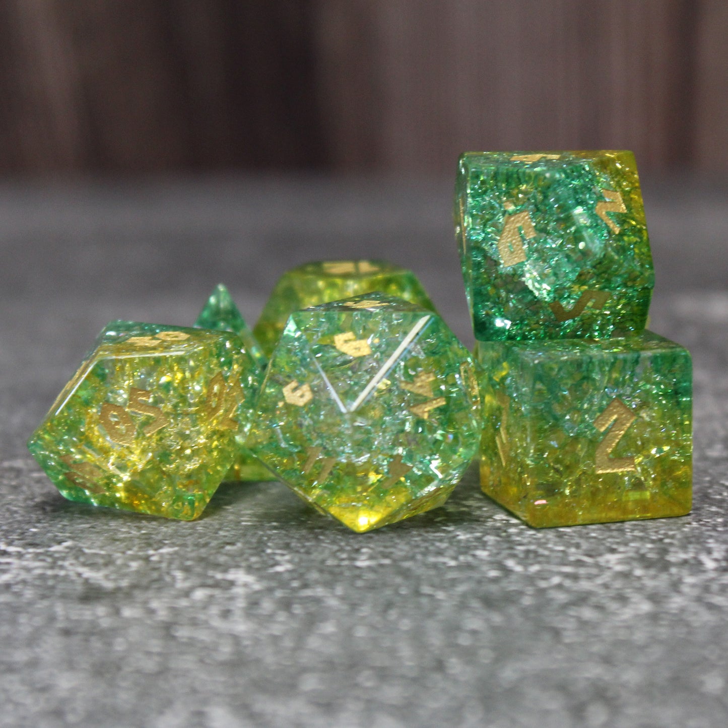 Grouped set highlighting the D20 die of the Frostbound Shattered Glass Dice, ideal for DnD gameplay.