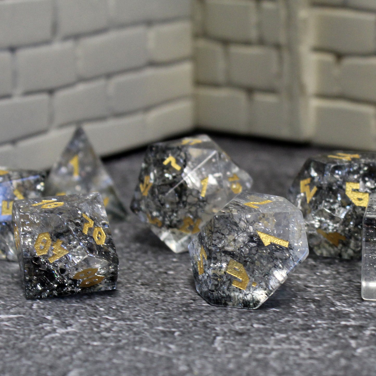 Dice set showcasing the cracked glass that appears to glow, ideal for Dungeons and Dragons sessions.