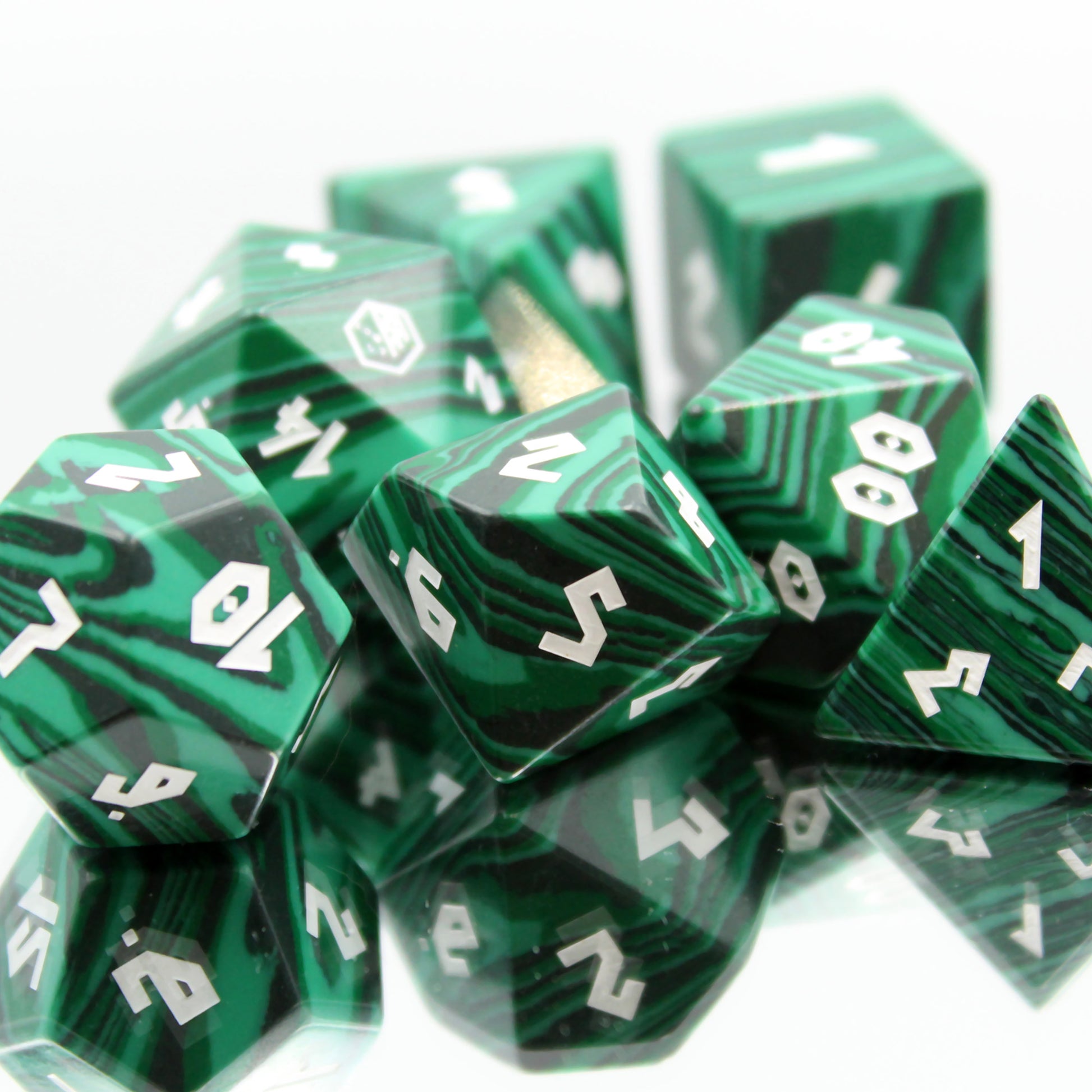 Another view of the dice set on a mirror, showcasing magical gemstone qualities and elegant design for tabletop gaming.