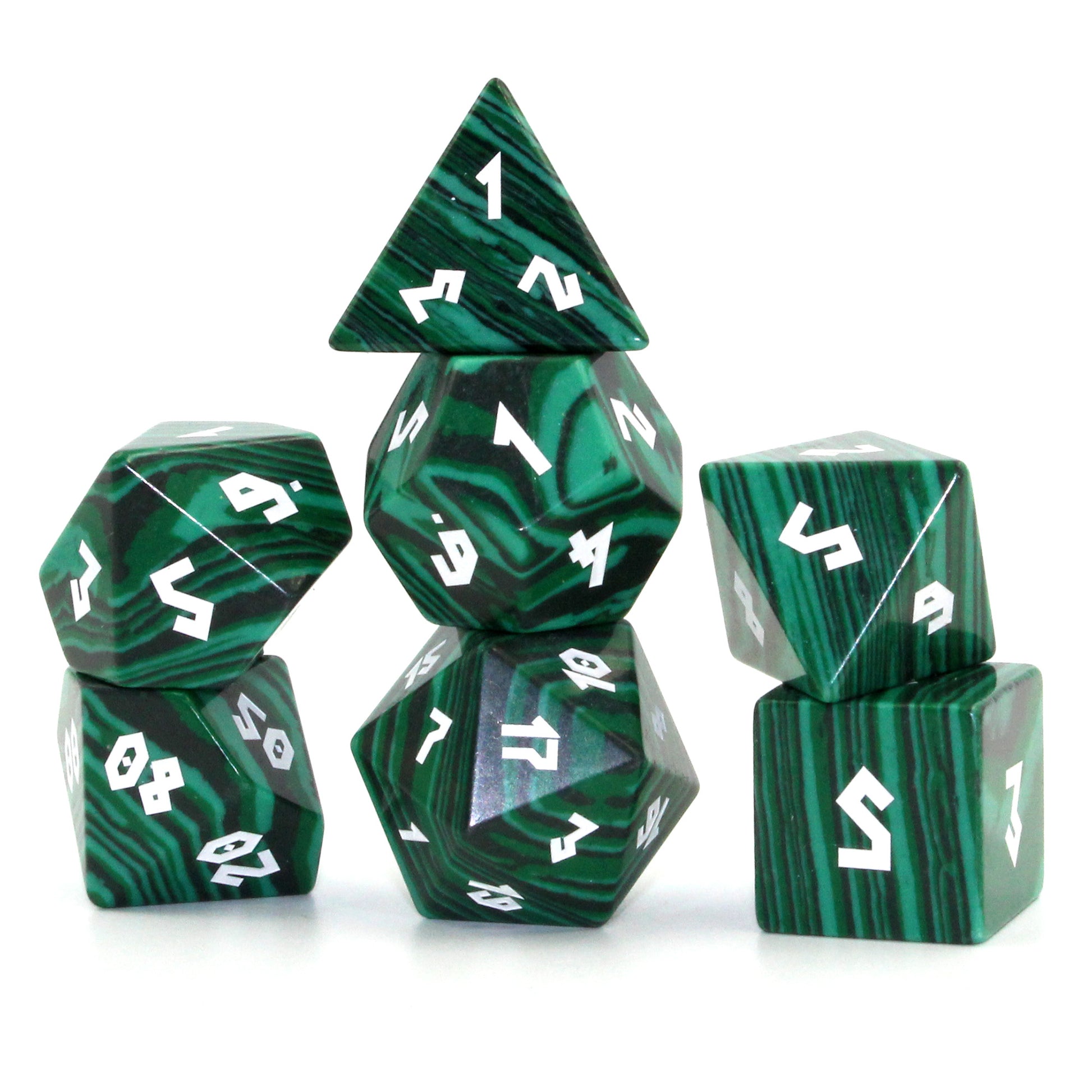 Stacked dice set on a white background, highlighting synthetic malachite's linear patterns and gold-carved numbers for tabletop RPGs.