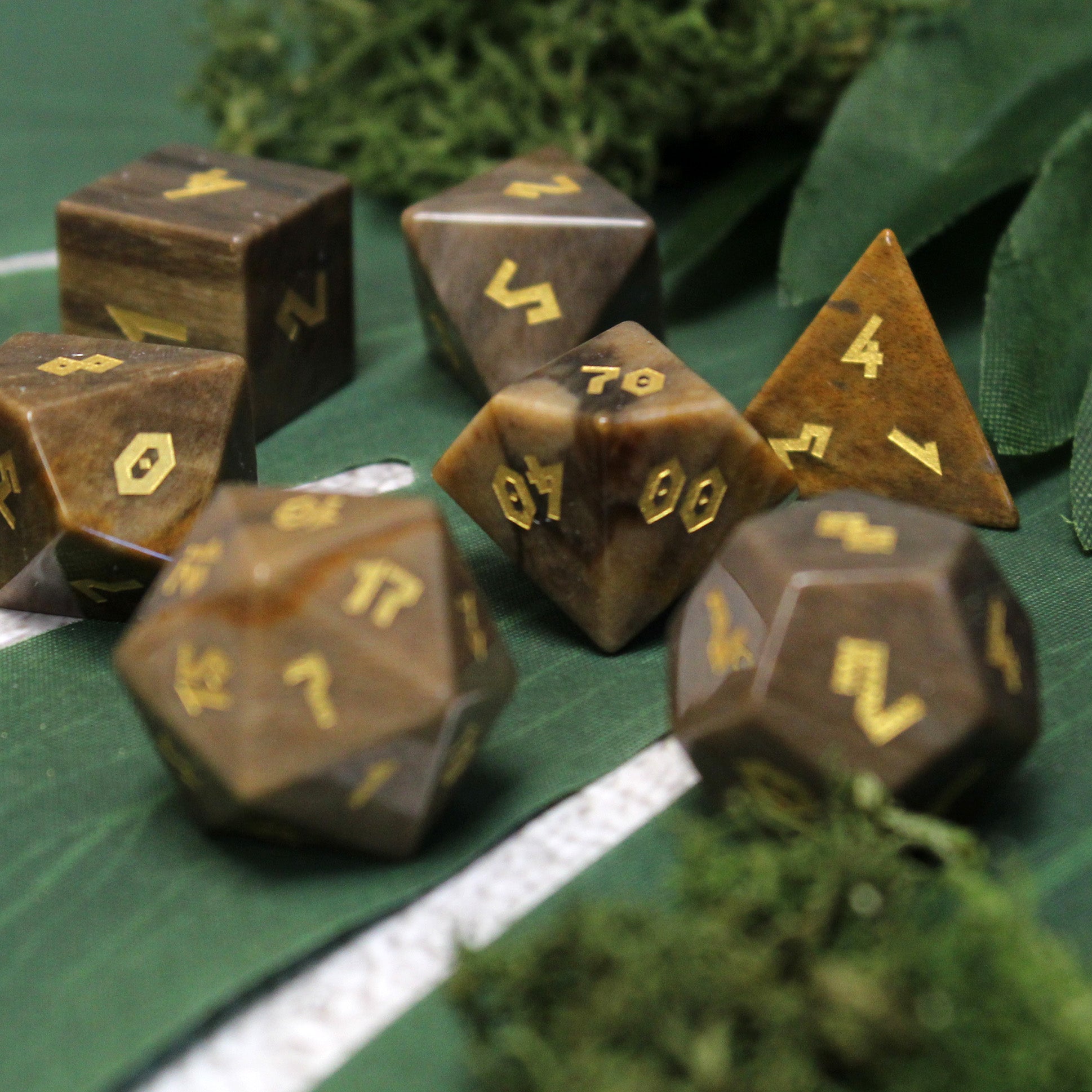 Dice set on green background, highlighting natural palette perfect for characters allied with nature in DnD.