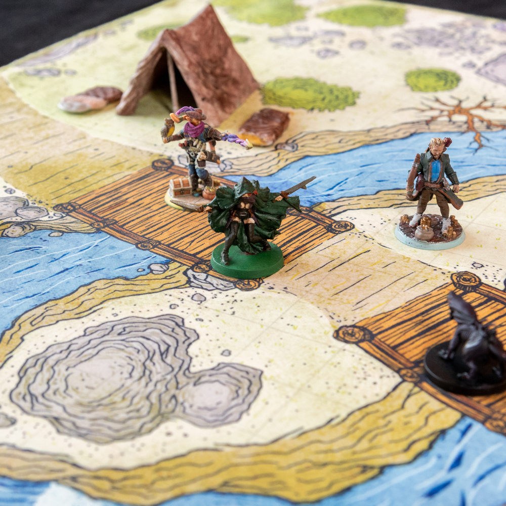 Closeup photo adventuring miniature figures on a cloth battle map of bridges over a river