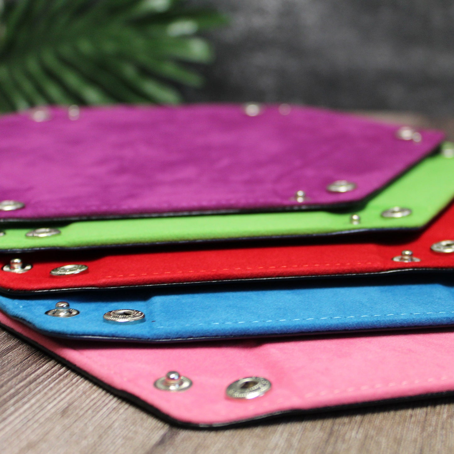 All color options of the Folding Dice Trays arranged flat in cascading colors, displaying the variety of vibrant colors.