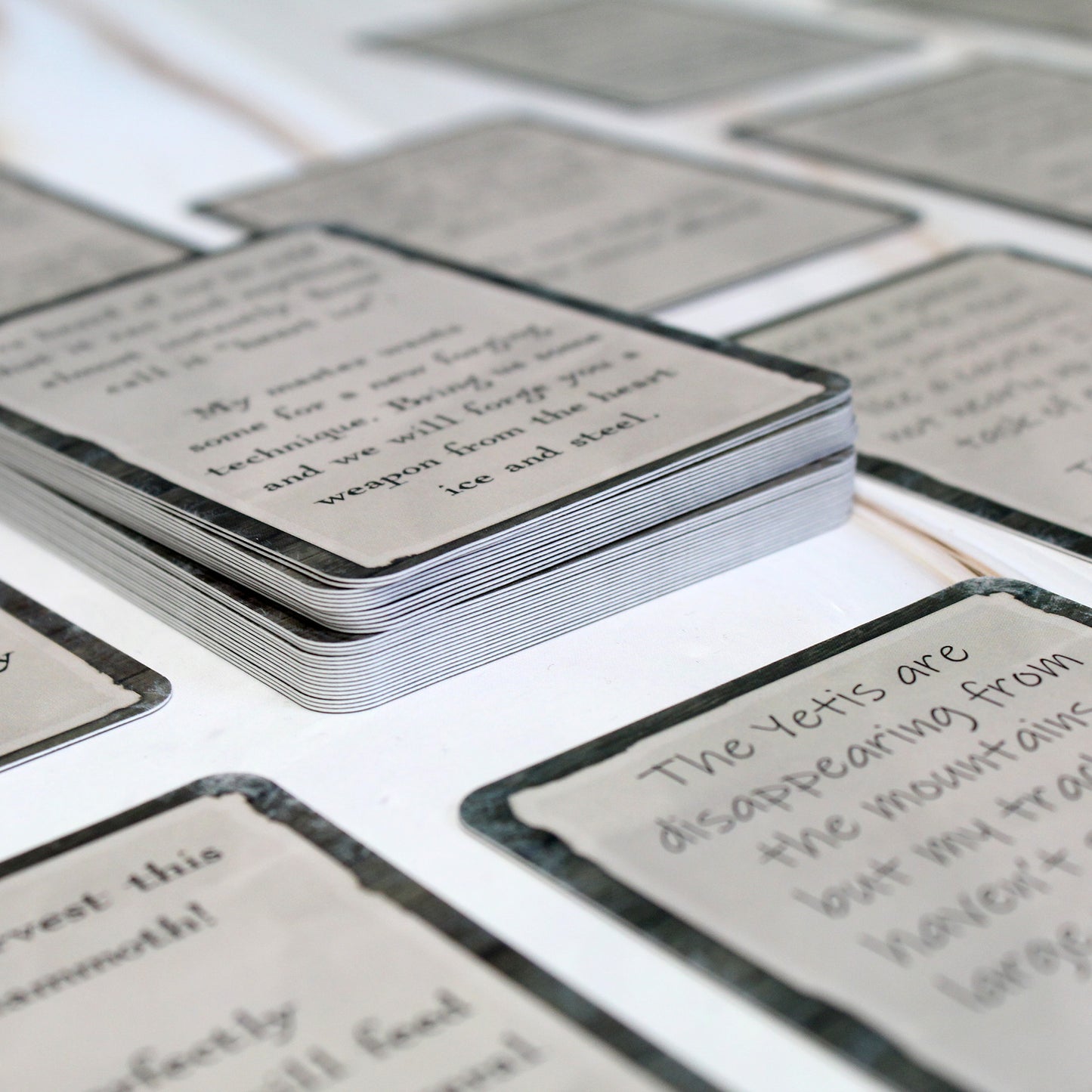 Snowbound quest cards laid out on a wooden table, offering side quest ideas for exploring frozen landscapes and ancient evils in your DnD and RPG sessions.