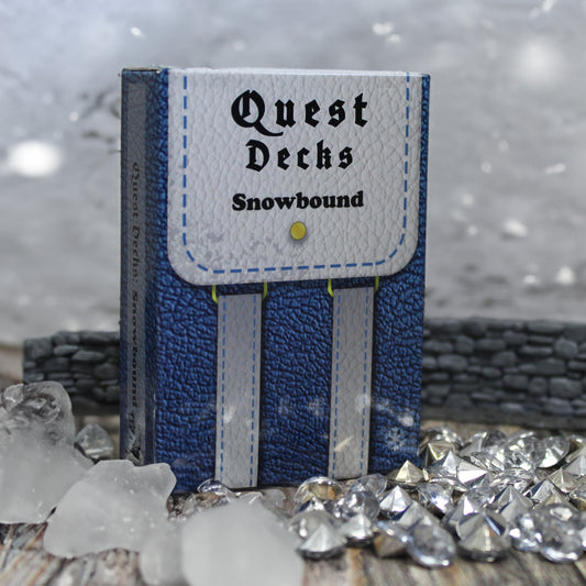 Quest Deck: Snowbound on a wintery background, the box is  designed to resemble a travel bag in blue and white, holding 45 unique quest cards.