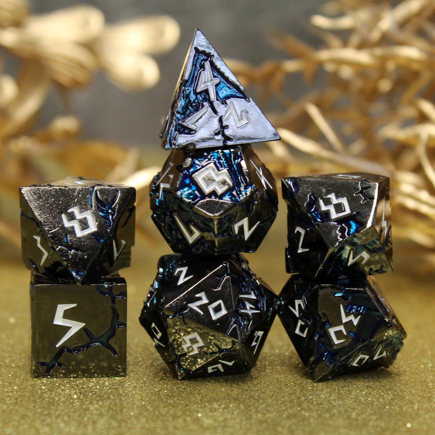 Stormrift black nickel metal dice set stacked, displaying deep blue scar design and white jagged numbers, perfect for D&D warlocks and necromancers.