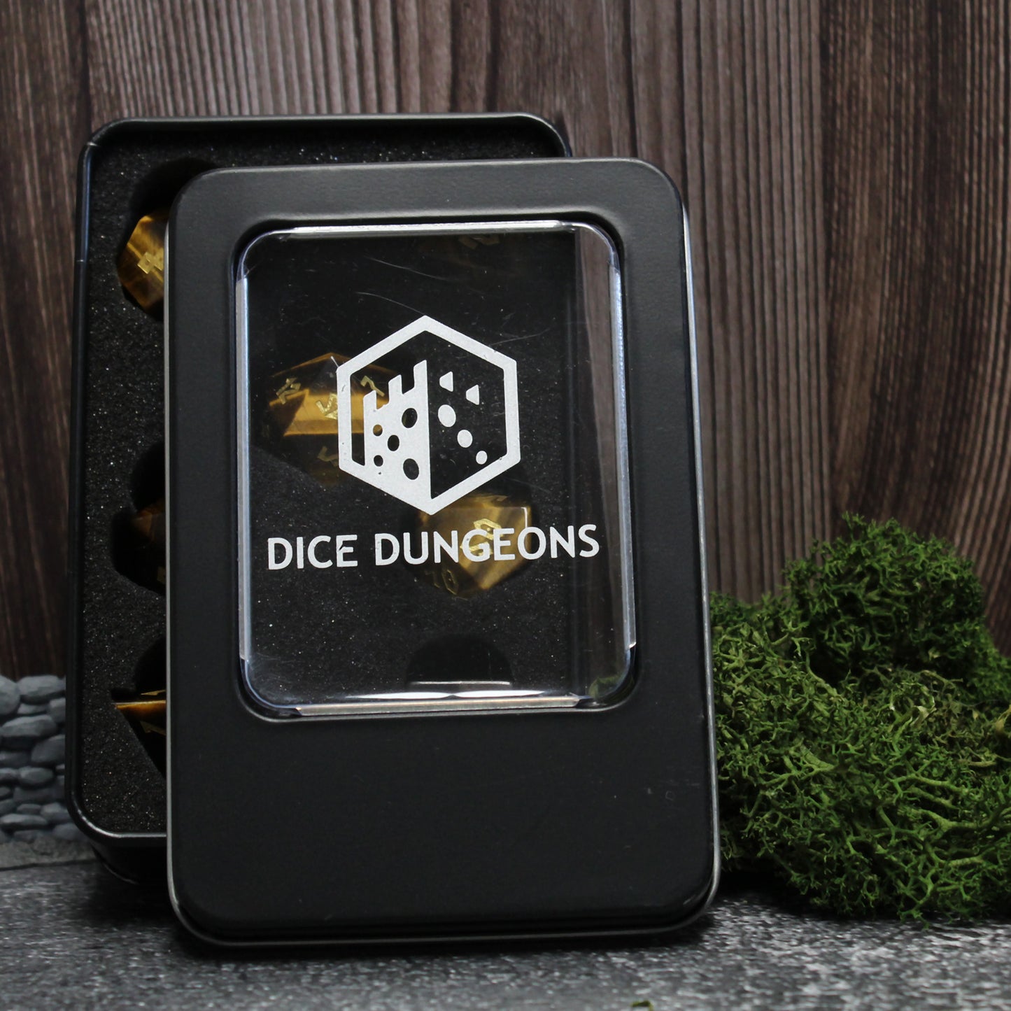 Tiger Eye dice set displayed in its included case, with rich colors and polished finish of the gemstone dice.