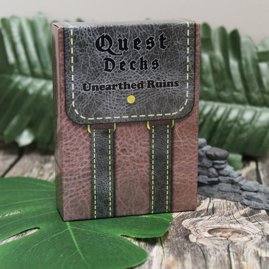 Quest Decks: Unearthed Ruins tuckbox standing upright on a table, ready to add side quests to your RPG campaigns.