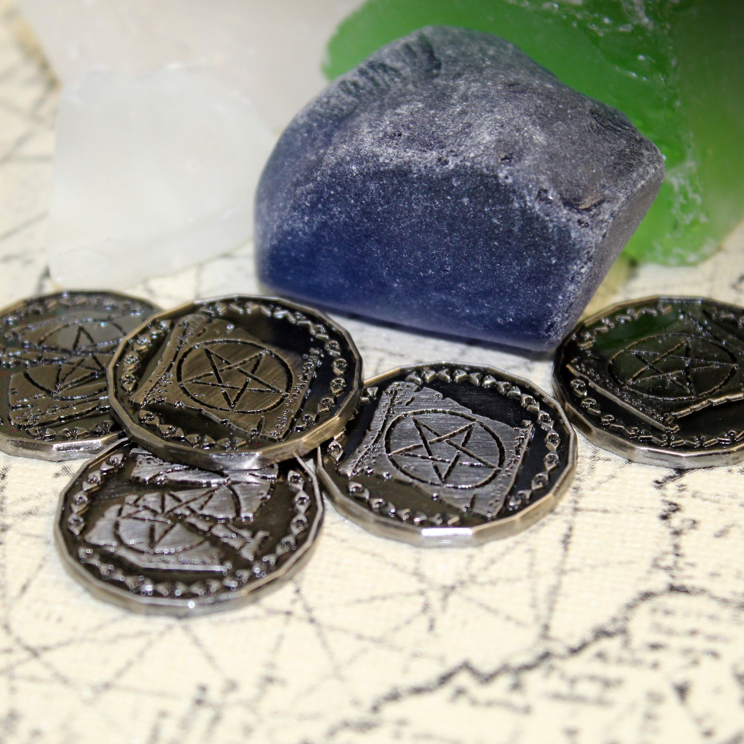 Five Silver Warlock Tokens on a Parchment Background