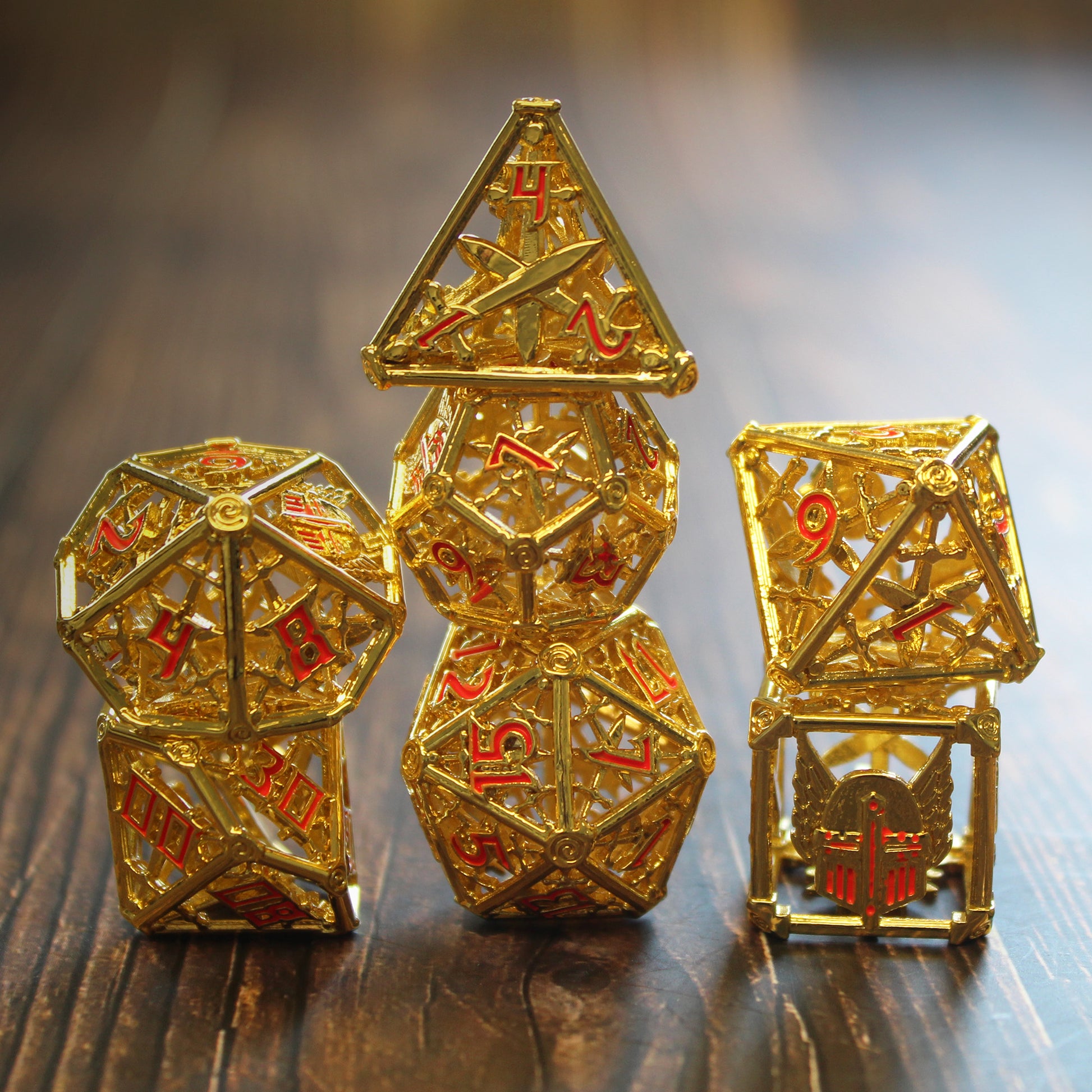 All 7 gold and red dice piled up in 3 stacks. Two dice in first stack, three dice in second stack, two dice in third stack. All on a dark wood paneled surface.