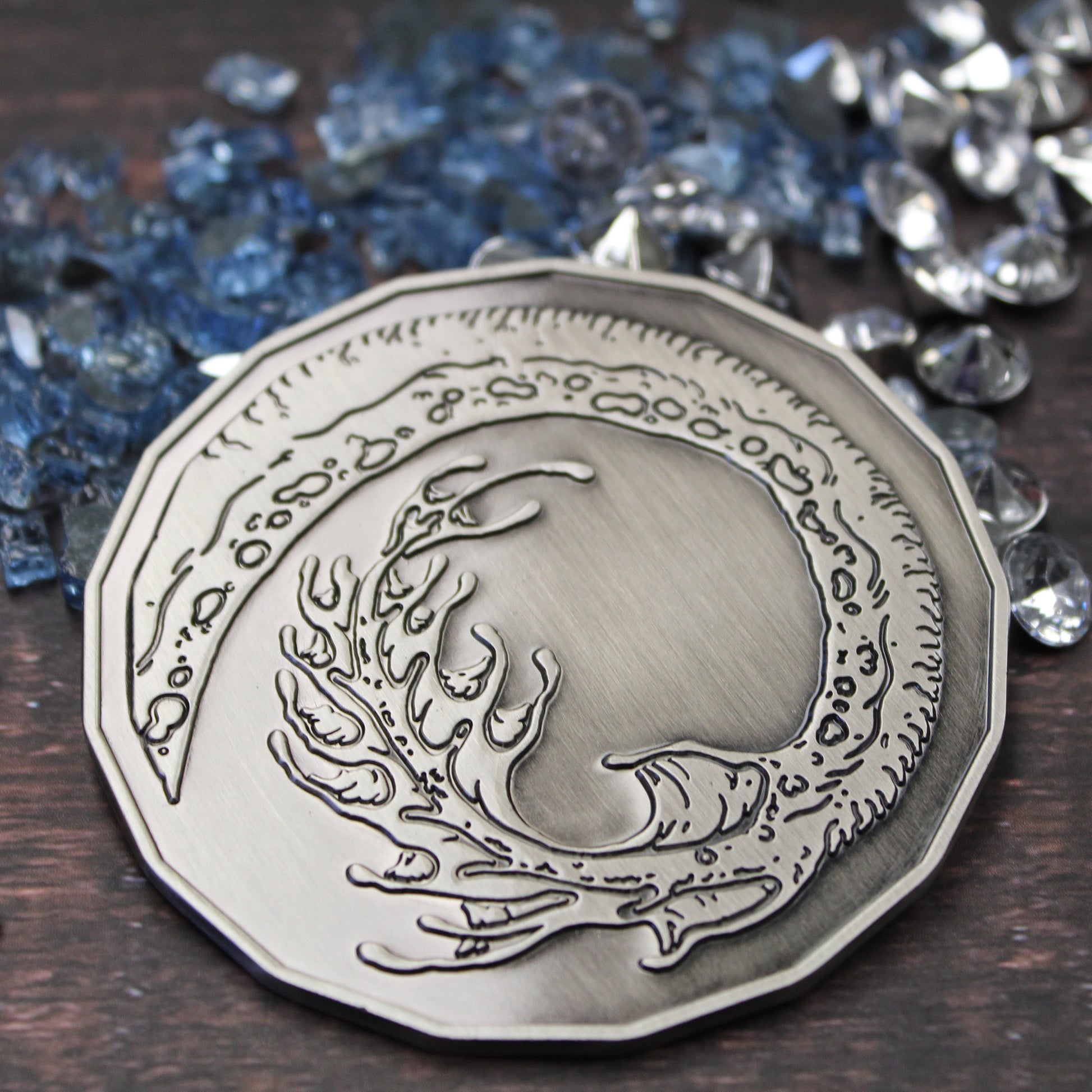 3-inch Smoke Dragon token displayed tails-side up on wooden tabletop.