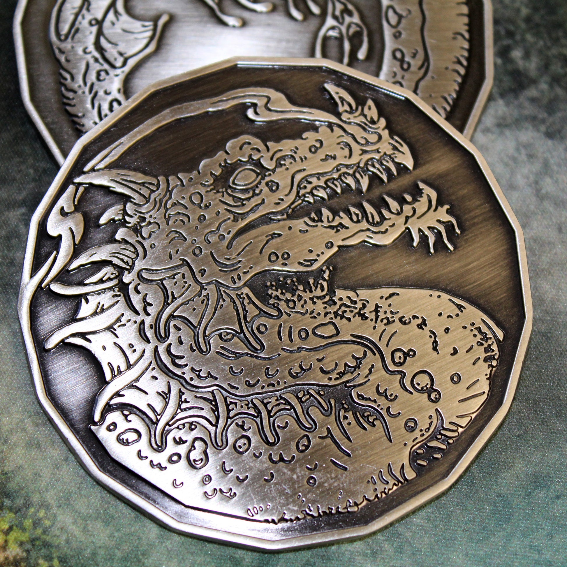 Extreme close-up of the Adult Smoke Dragon monster token, showcasing the intricate detailing of the engraved dragon.