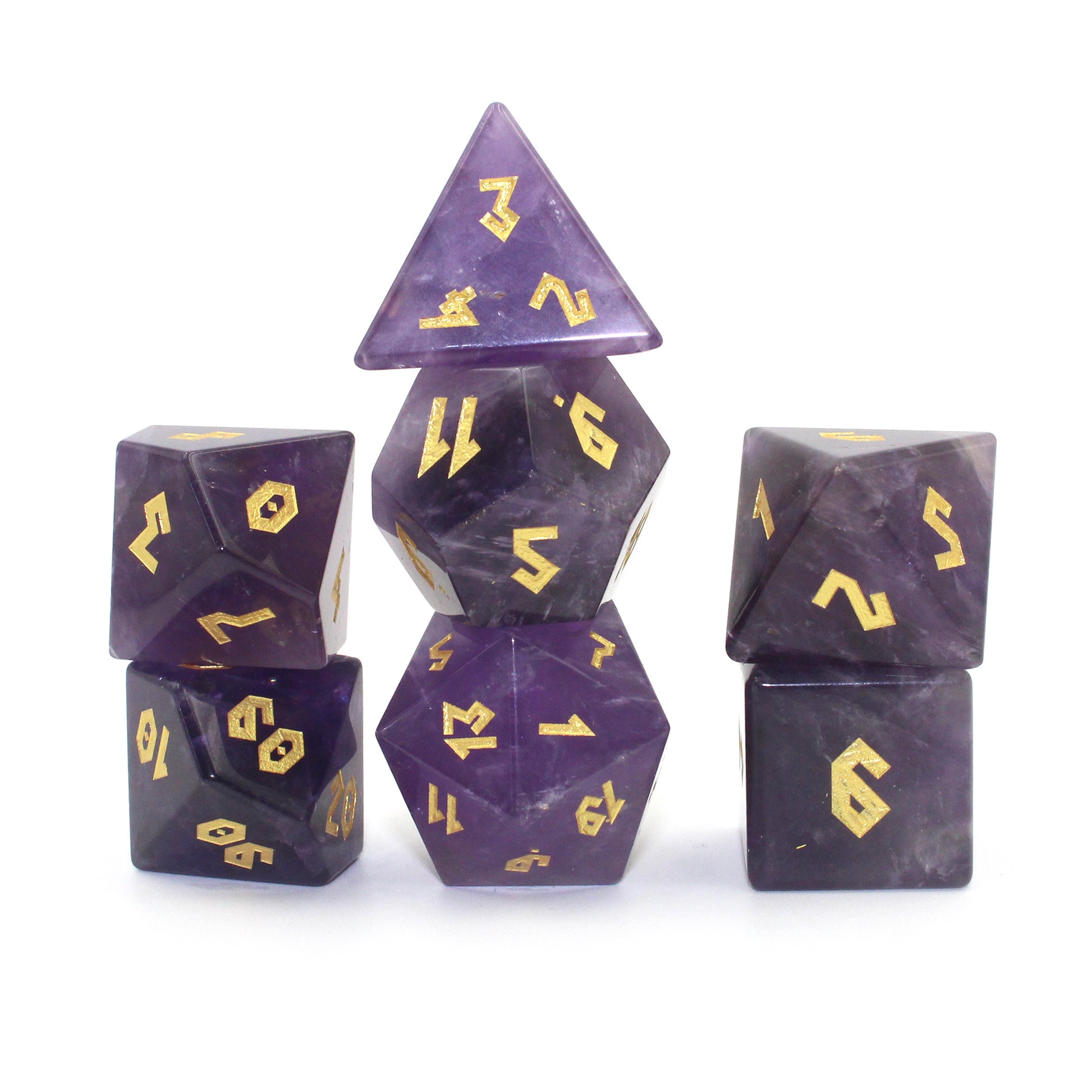 Stacked Amethyst dice set on a white background, featuring the luxurious purple stones and gold numbering in a Roman font.