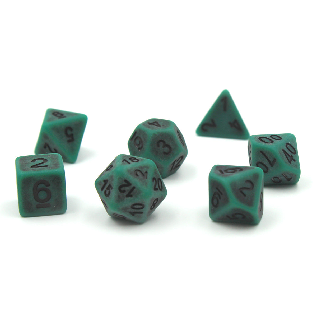 Set of seven green plastic dice with black numbering designed to look aged