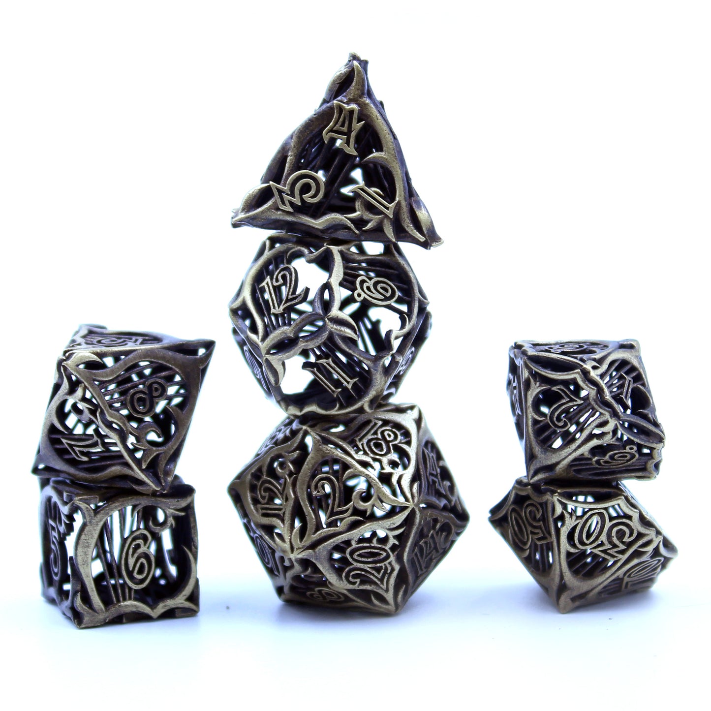 Stacked set of seven hollow metal bard-inspired bronze rpg dice with uninked numbers and harp motifs on each face on a white background