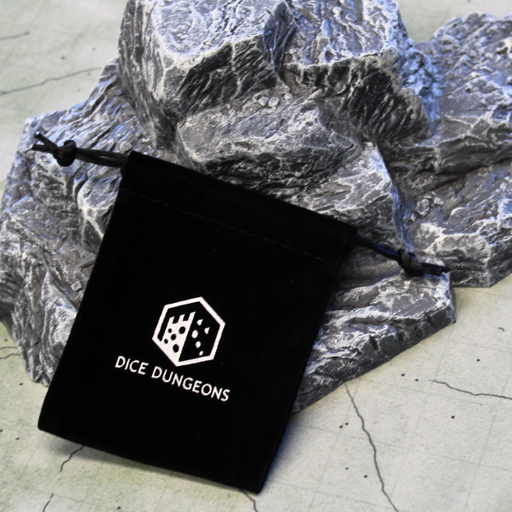 Dreawstring dice bag from Dice Dungeons. Holds 1-2 sets of rpg dice.