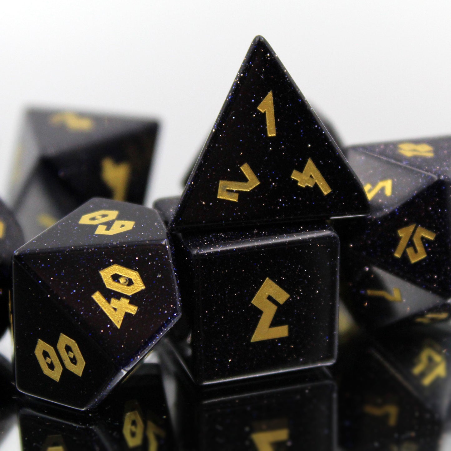 Zoomed in of the Blue Goldstone Dice Set, with sparkling blue stone.
