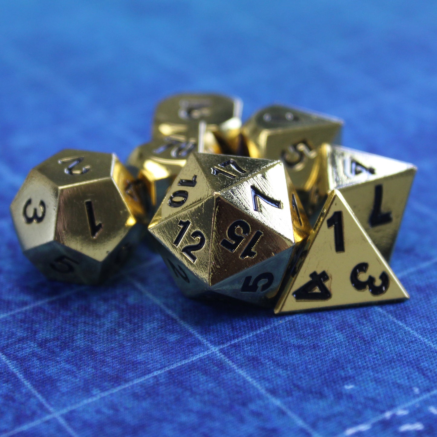Metal Bright Gold Dice on recommended rolling mat, ensuring safe rolls and enhancing gaming experience.