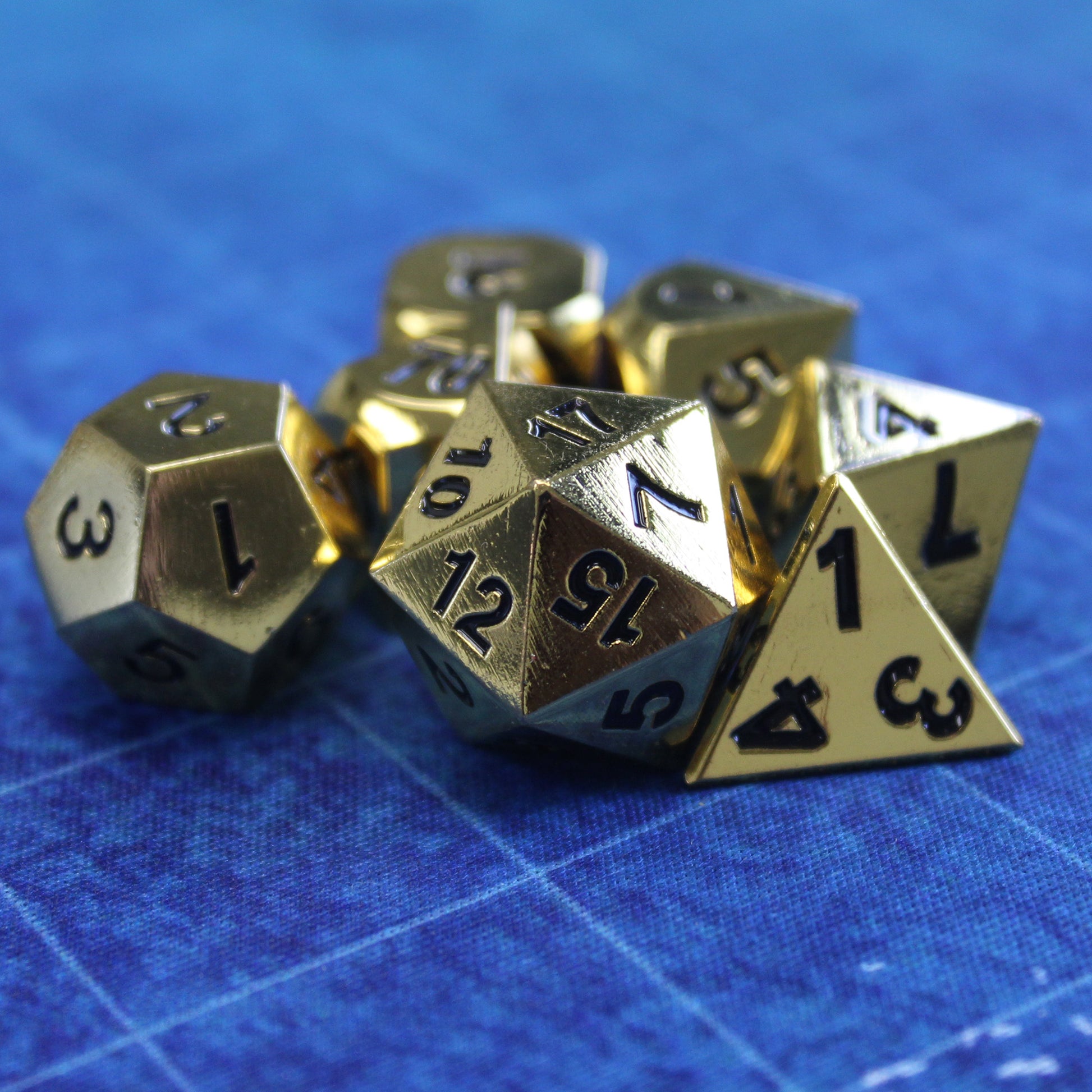 Metal Bright Gold Dice on recommended rolling mat, ensuring safe rolls and enhancing gaming experience.