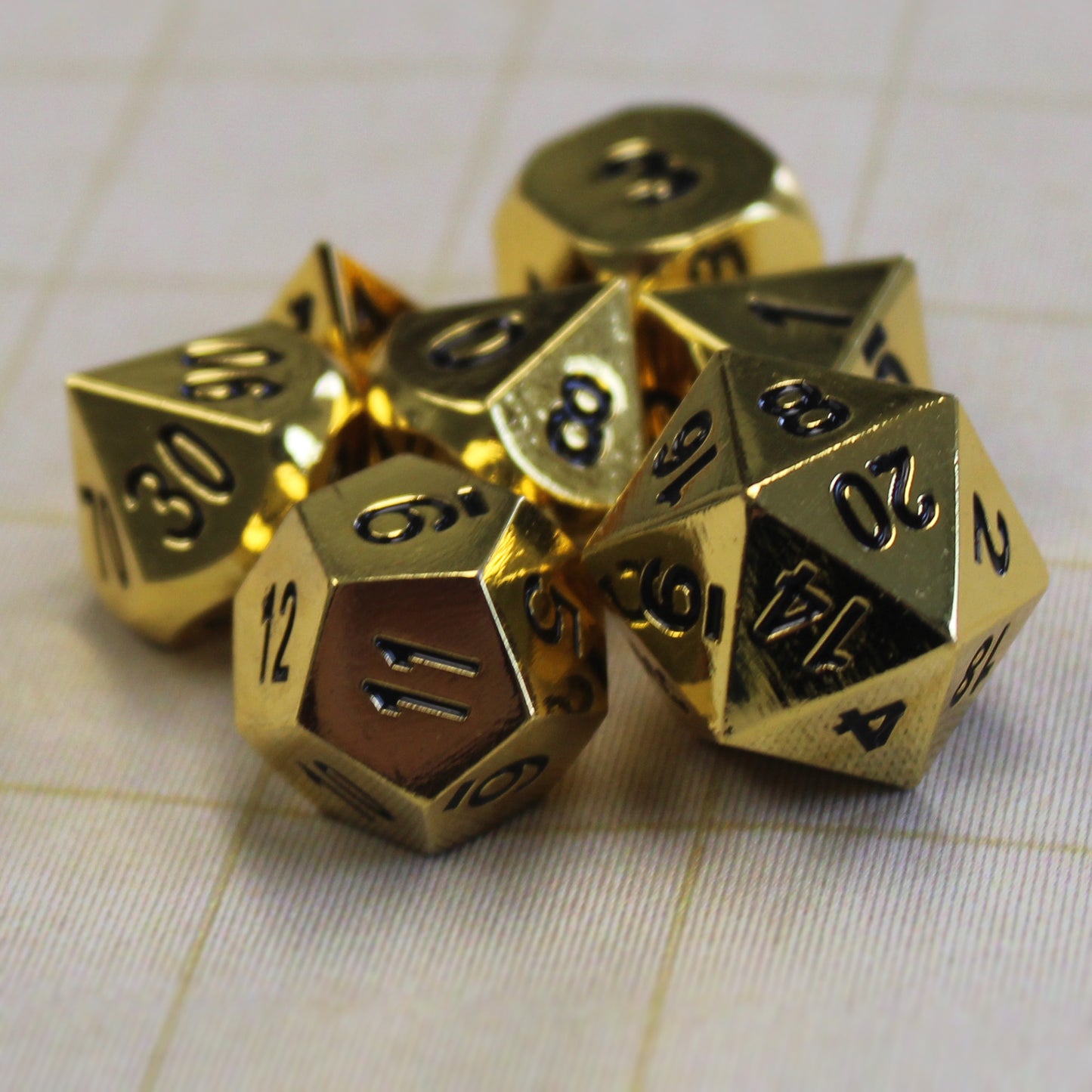 Dice set on a gridded battlemap, ready for Dungeons and Dragons adventures with noble flair.
