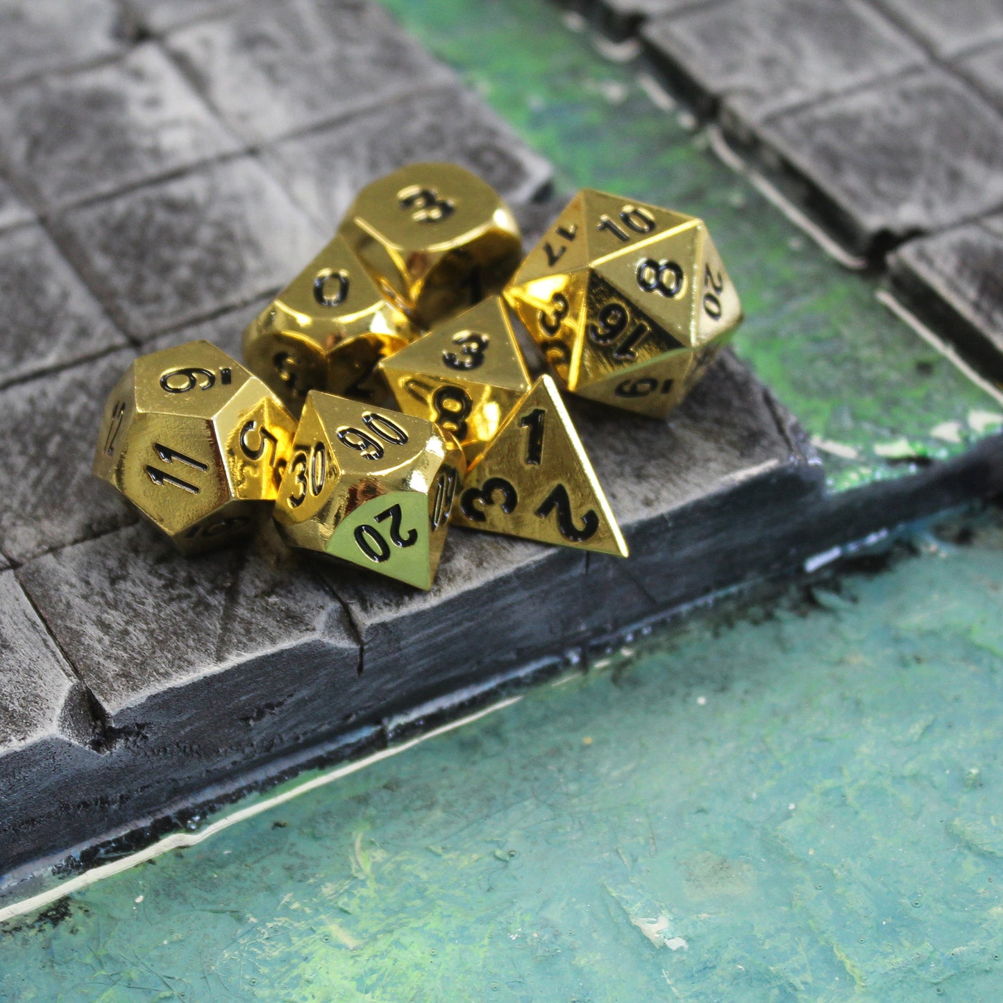 Metal Bright Gold Dice on dungeon terrain, adding a touch of luxury to your tabletop RPG sessions.
