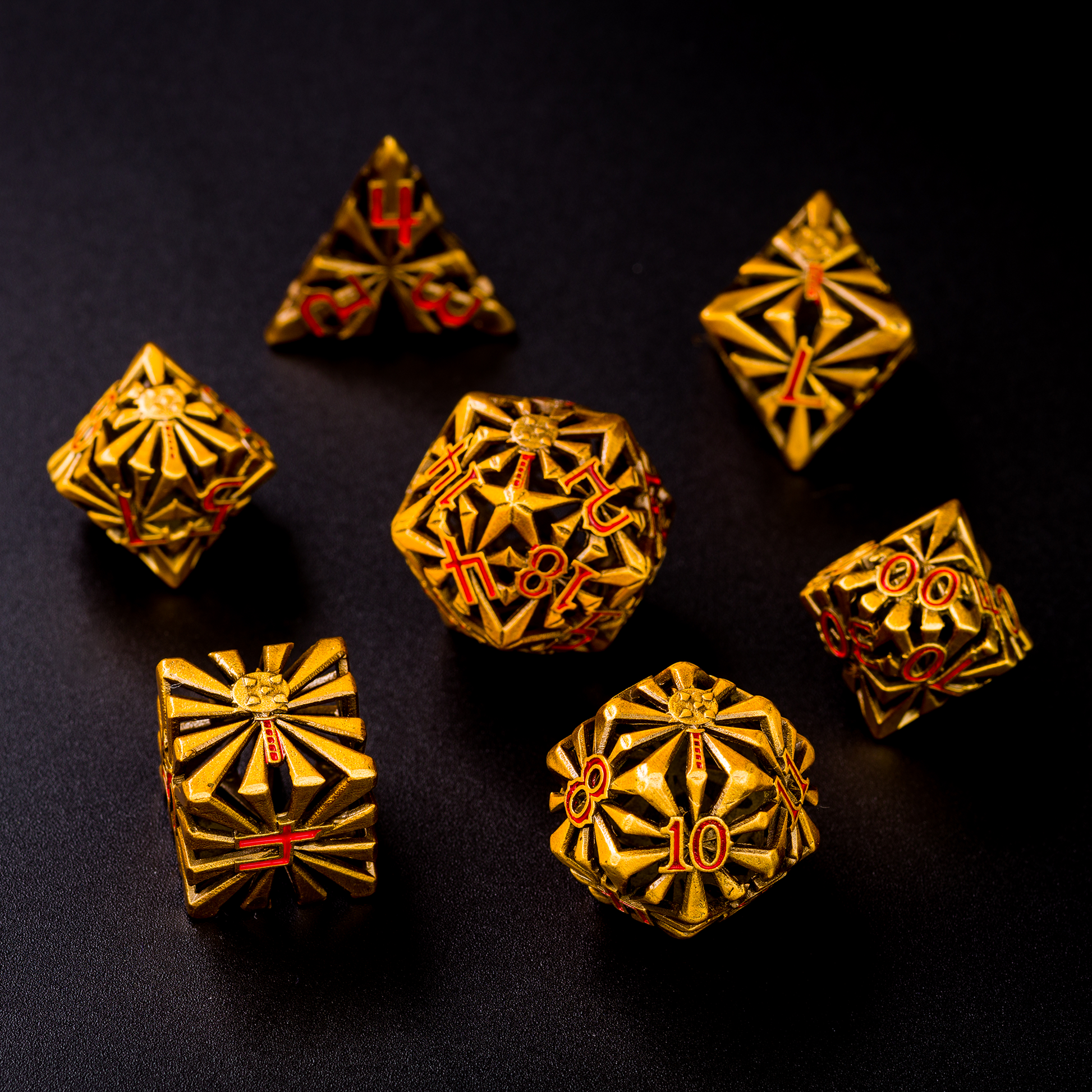 Set of set of seven gold-colored cleric-inspired hollow metal dice with red numbers and a mace in place of the high number on each die on a black background