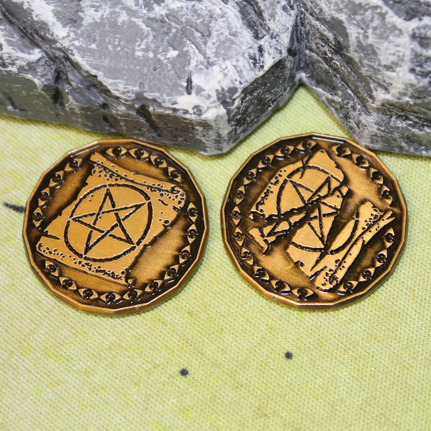 Close Up of Two Gold Warlock Tokens on a Battle Map