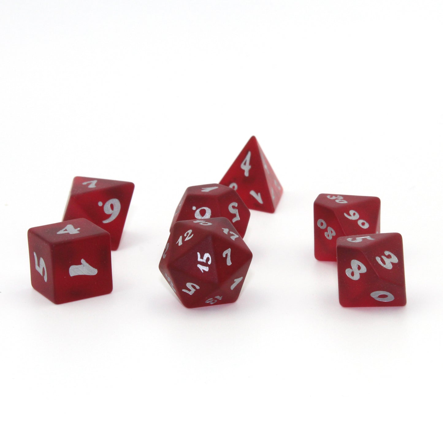 A set of red translucent glass RPG dice with silver numbering