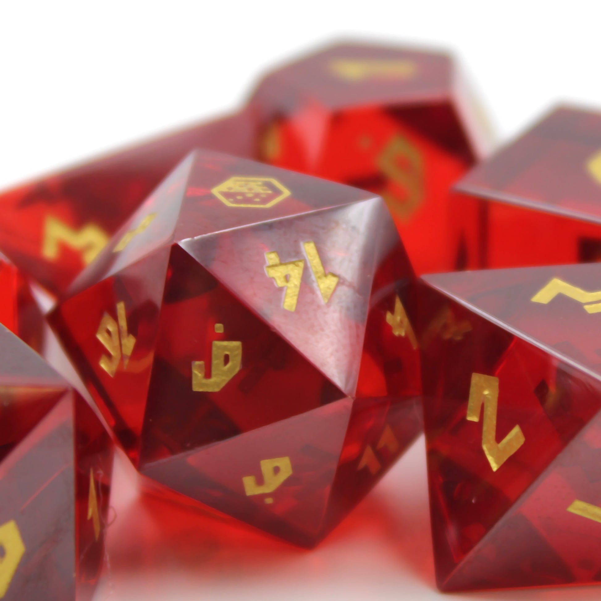 Close-up of Red Cubic Zirconia D20 with a reflective surface and gold numbering.