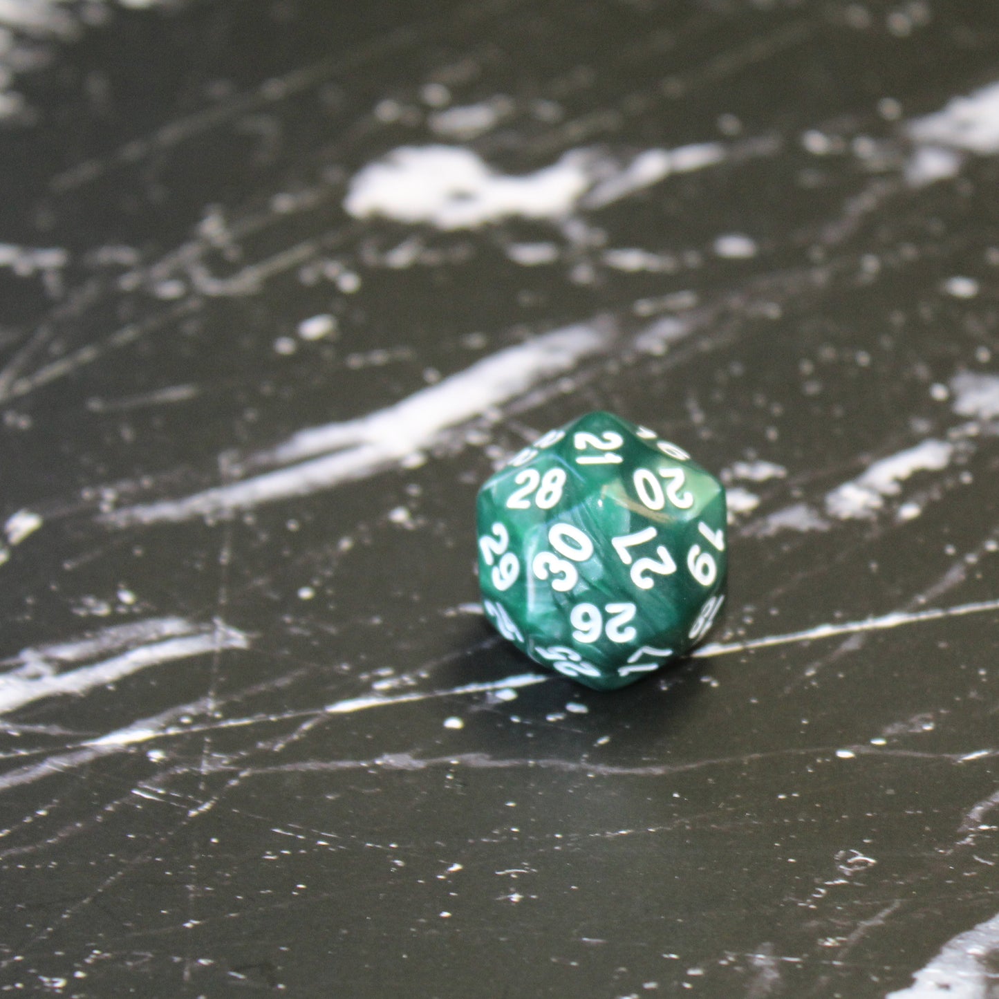 Green Pearl D30 dice with white numbering, featuring a pearlescent finish.