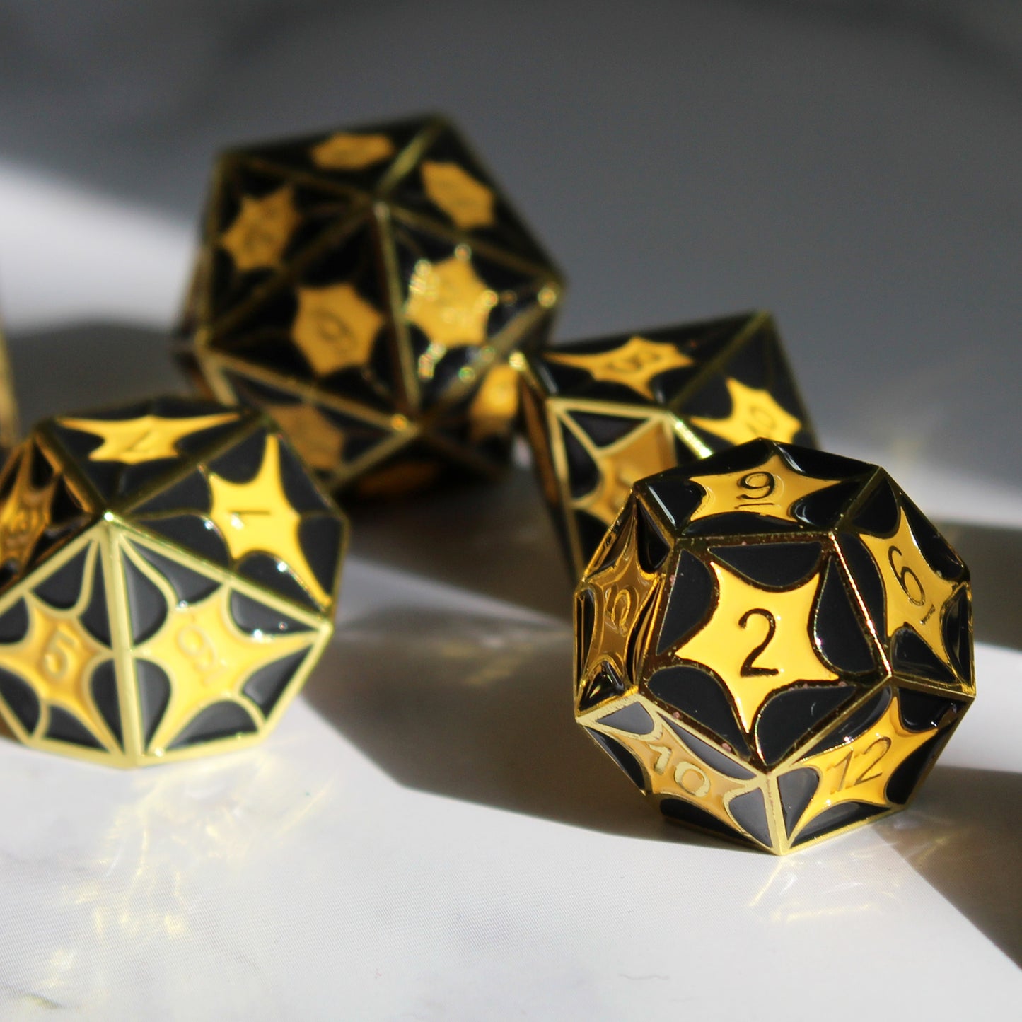 Detailed view of the D12 die with dragon scale design, showing symmetrical pattern for balanced gameplay.