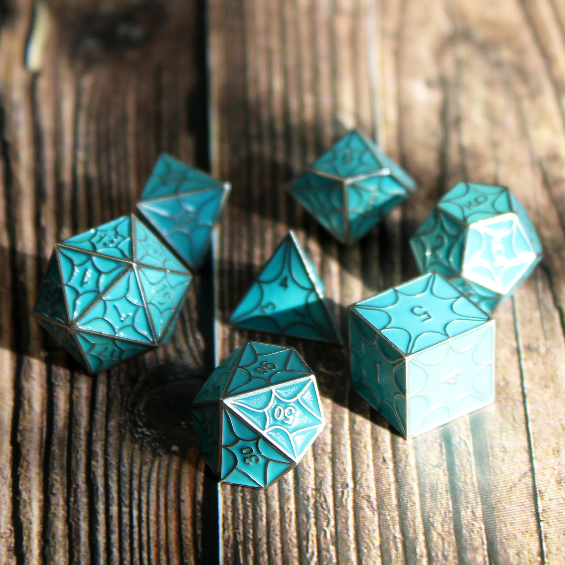 Faerie dragon dice set charging in sunlight on a wooden table, ready for Dungeons and Dragons.