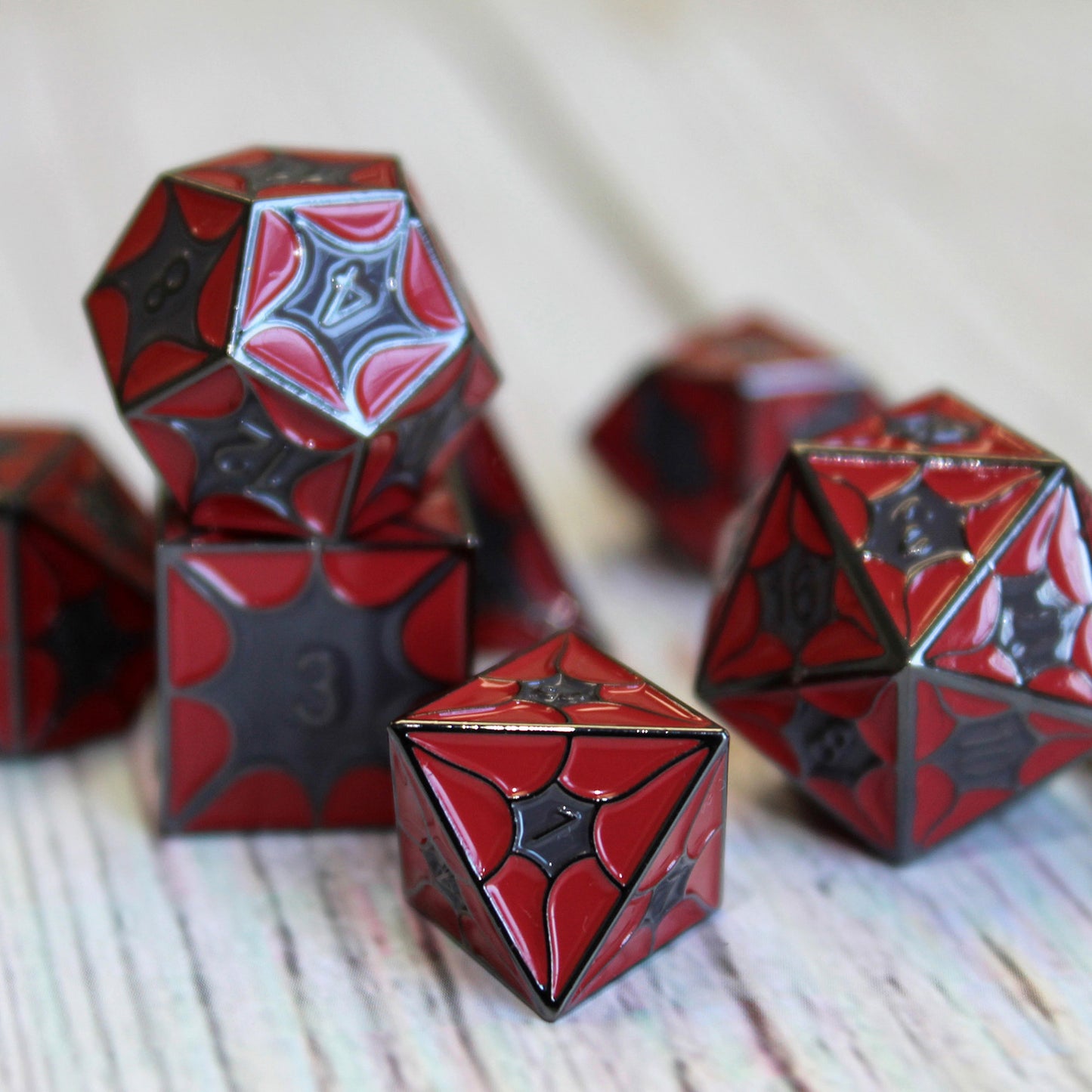 Dragonscale Set on table. Enamel colors are blood red and dark gray with the numbering black nickel.