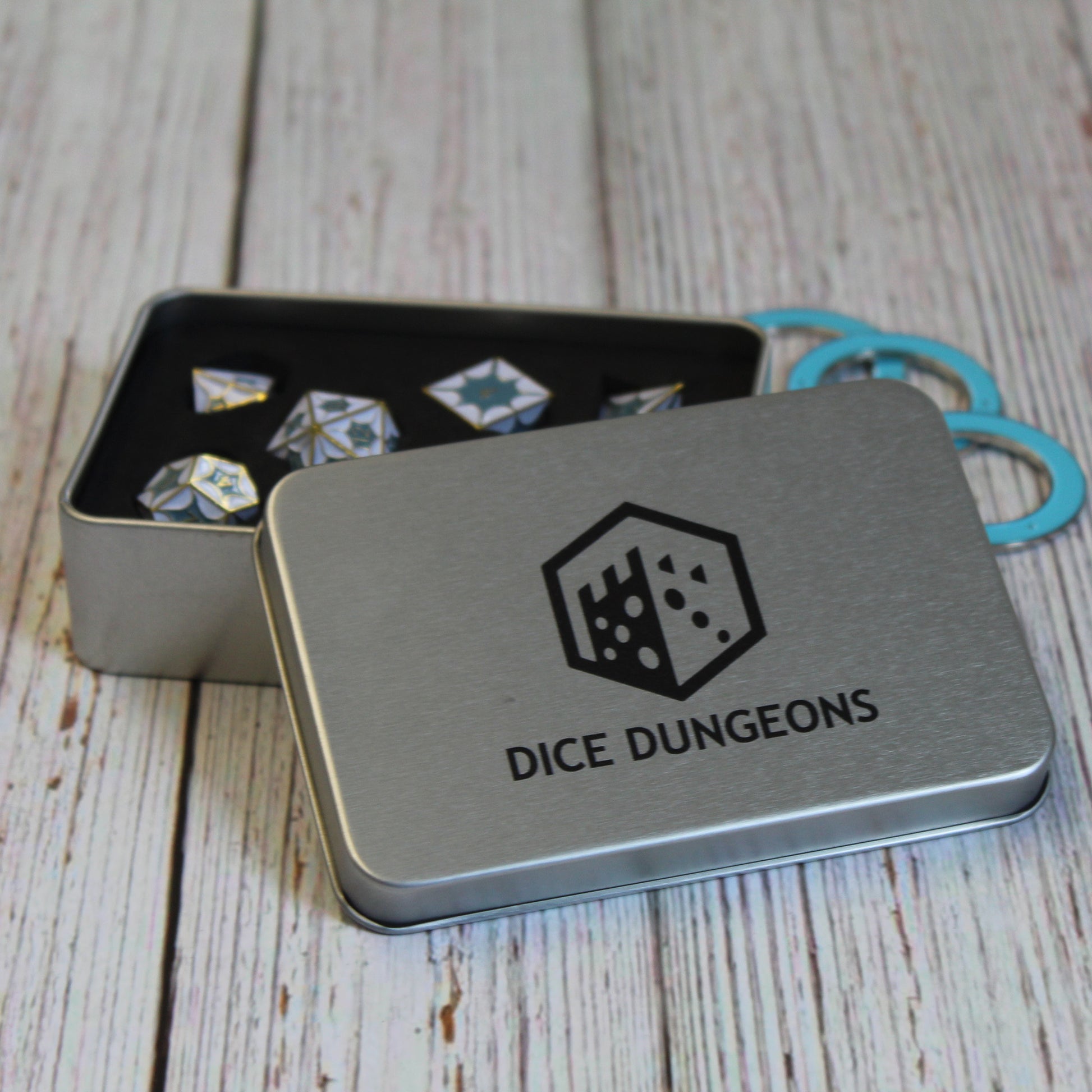Metal DragonScale White Dice Set nestled in a deluxe display box, ready for DnD and tabletop RPGs.