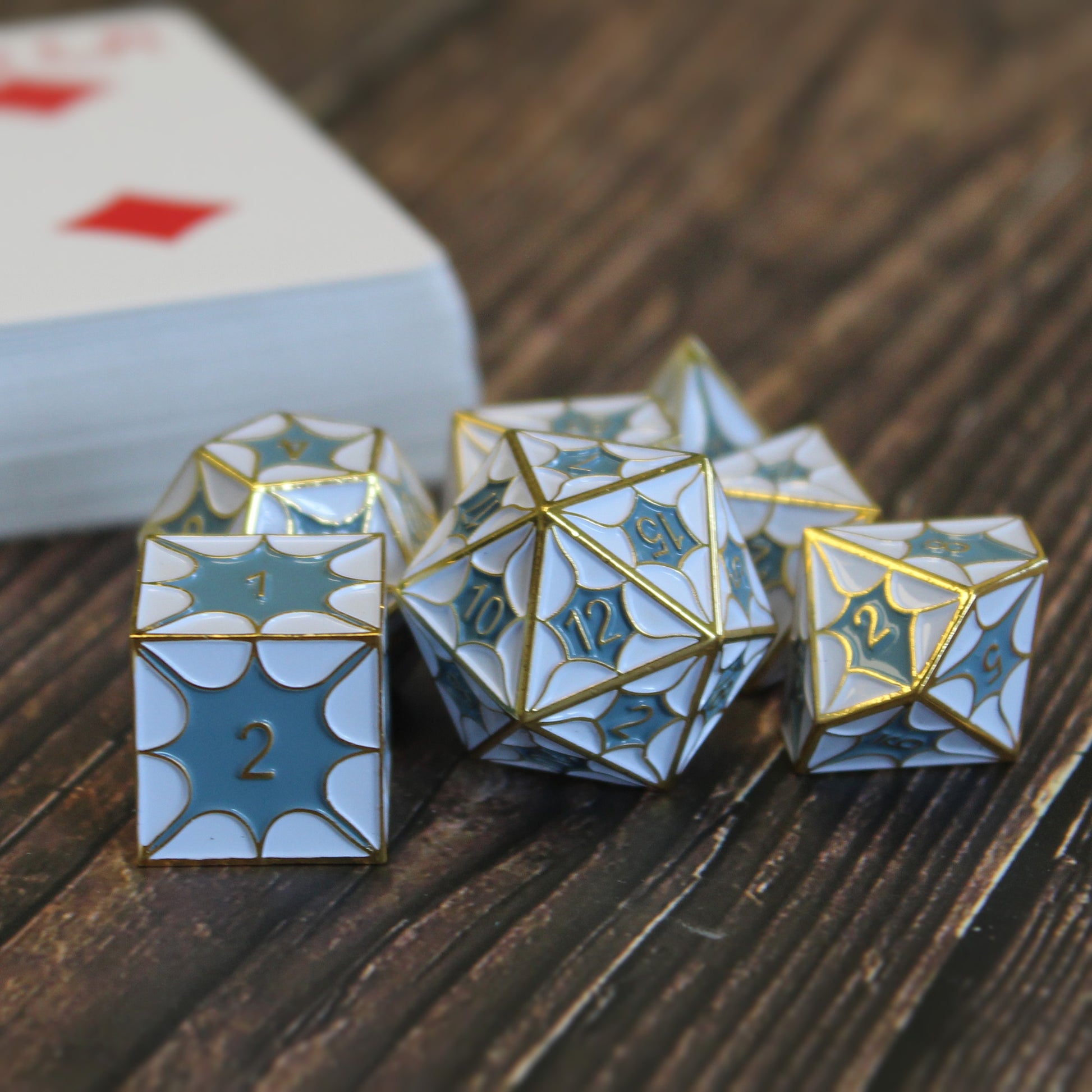 Metal DragonScale White Dice Set arranged on a game table, perfect for Dungeons and Dragons adventures.