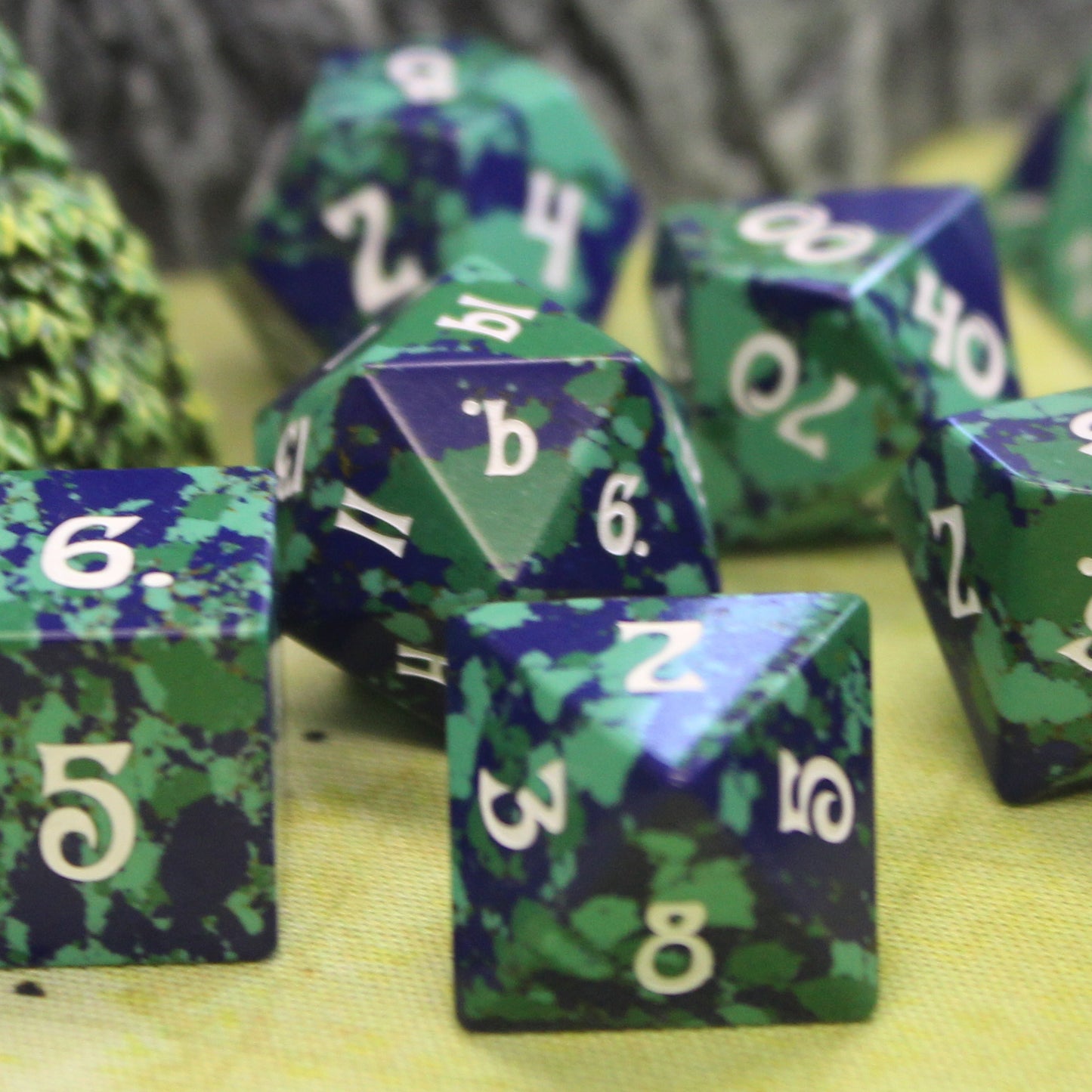 Close-up of Gaia Dice Set, highlighting unique swirling patterns and mid-century aesthetics; that looks like a mini earth.