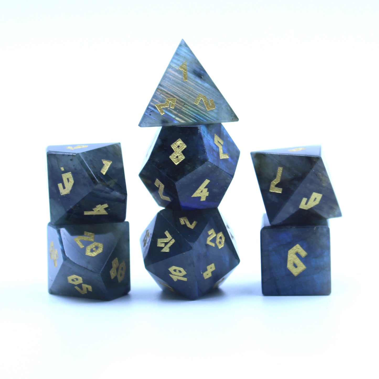 Labradorite dice set stacked in three columns on a white background.