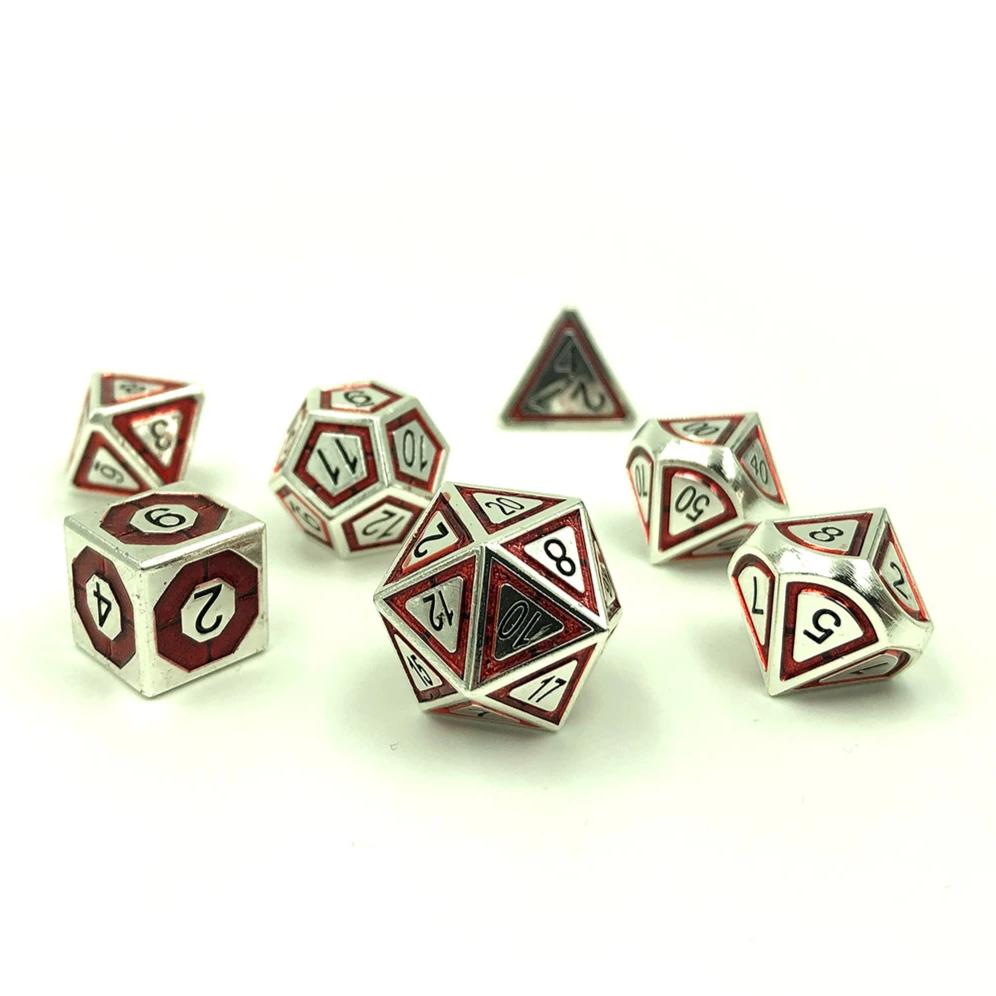 Metal BullsEye red dice set scattered on a white background