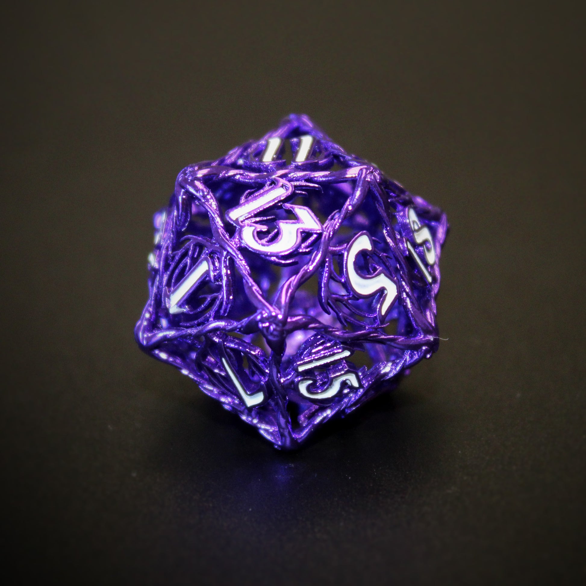 Close up of purple Ranger D20 die with white inking. Die is showing 13 side on a black background.