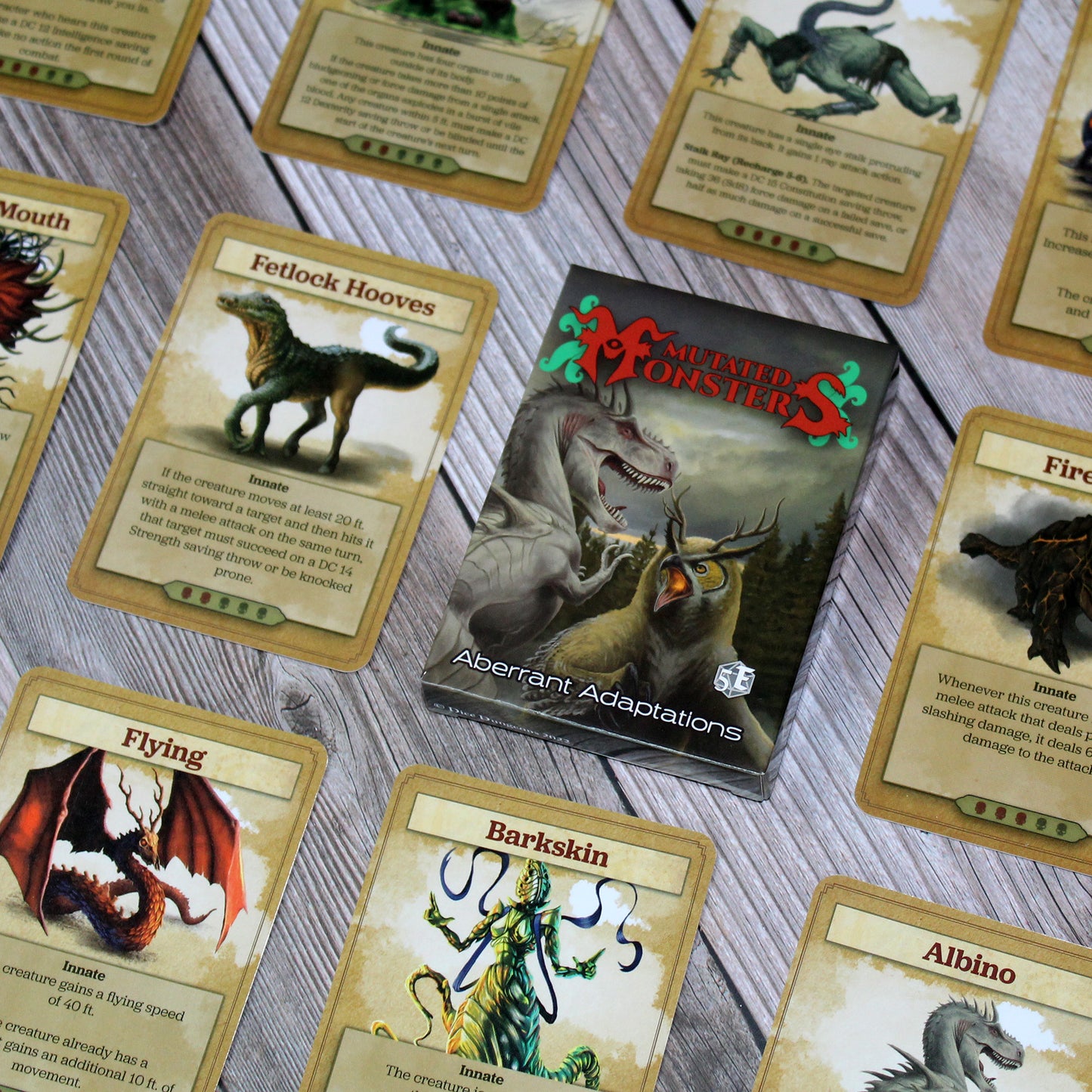 Deck box in the center of the image with individual cards from the deck spaced out equidistant from each other in a repeating pattern, all on a white wood paneled background.