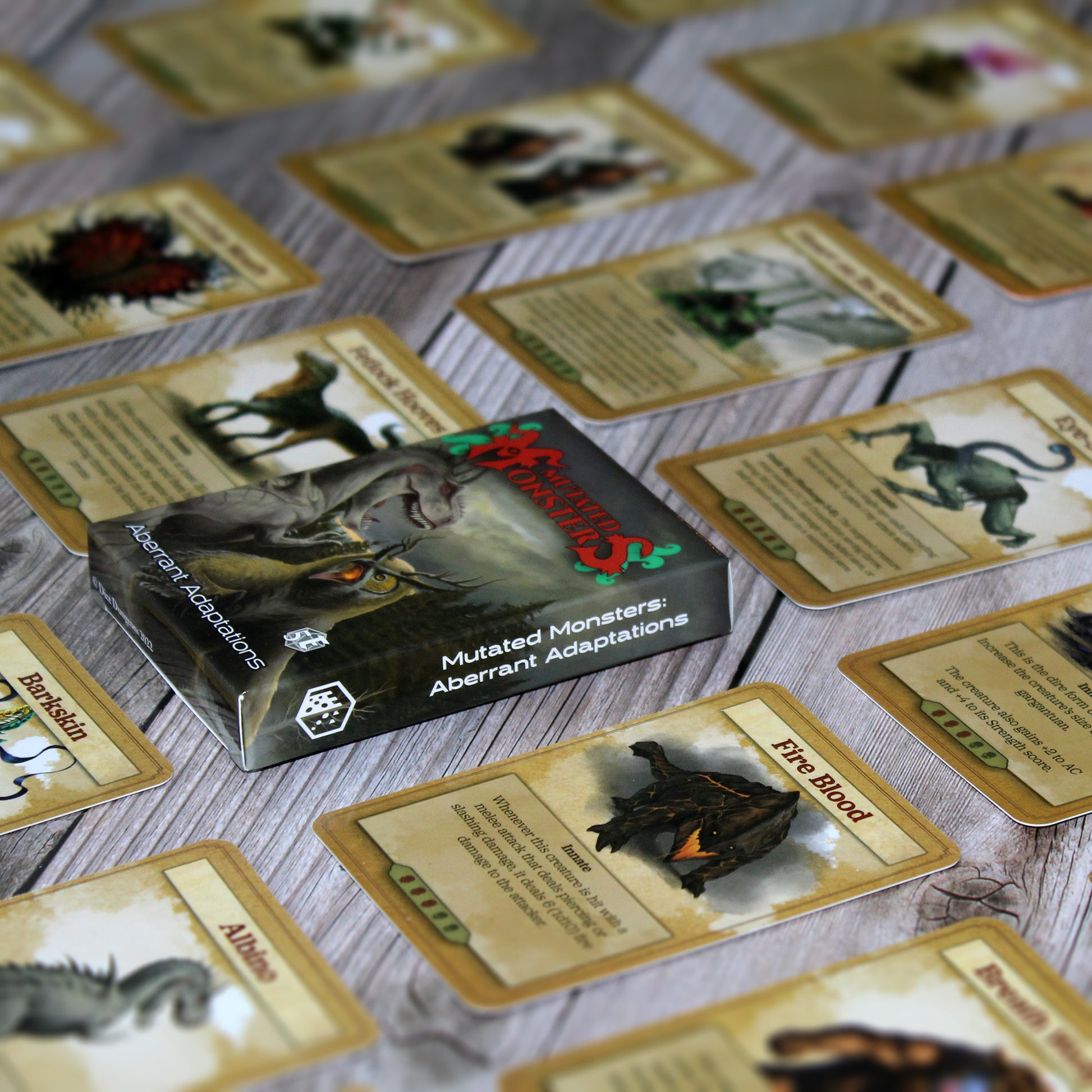 Deck box in the center of the image with individual cards from the deck spaced out equidistant from each other in a repeating pattern, all on a white wood paneled background.