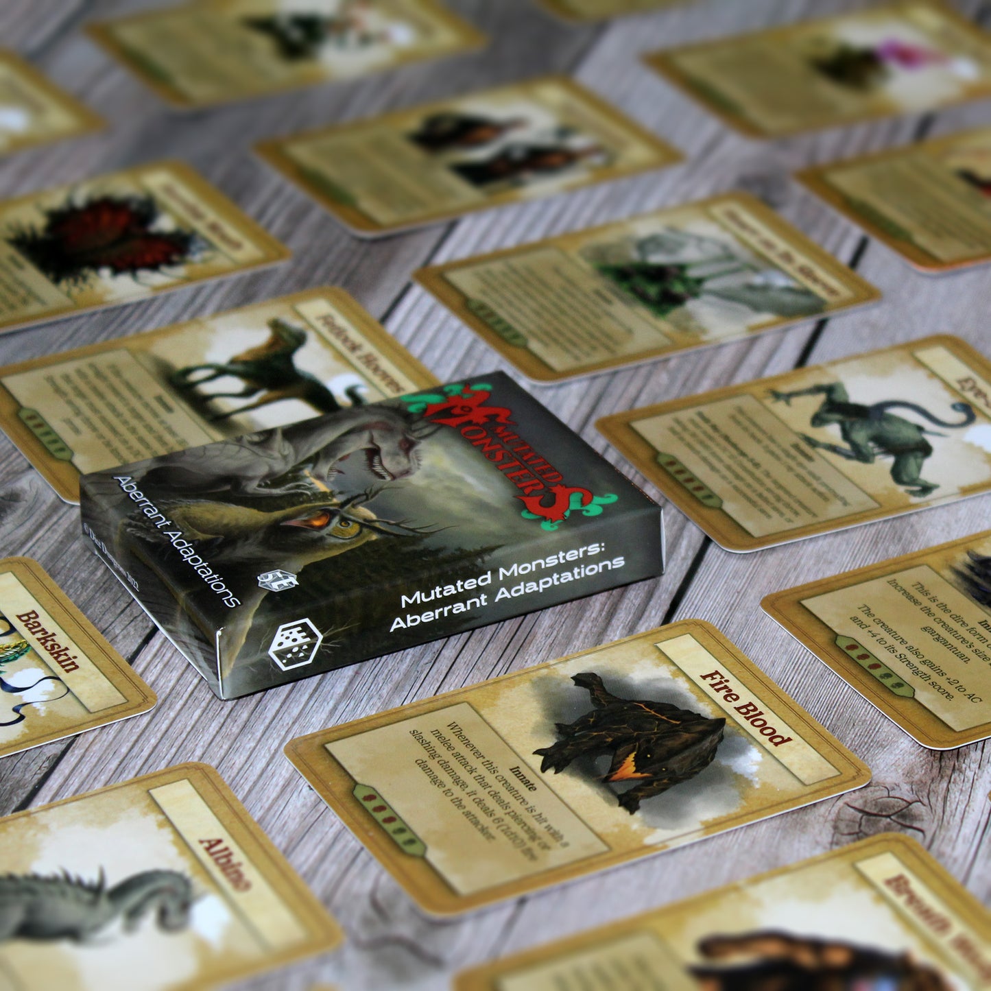 Deck box in the center of the image with individual cards from the deck spaced out equidistant from each other in a repeating pattern, all on a white wood paneled background.
