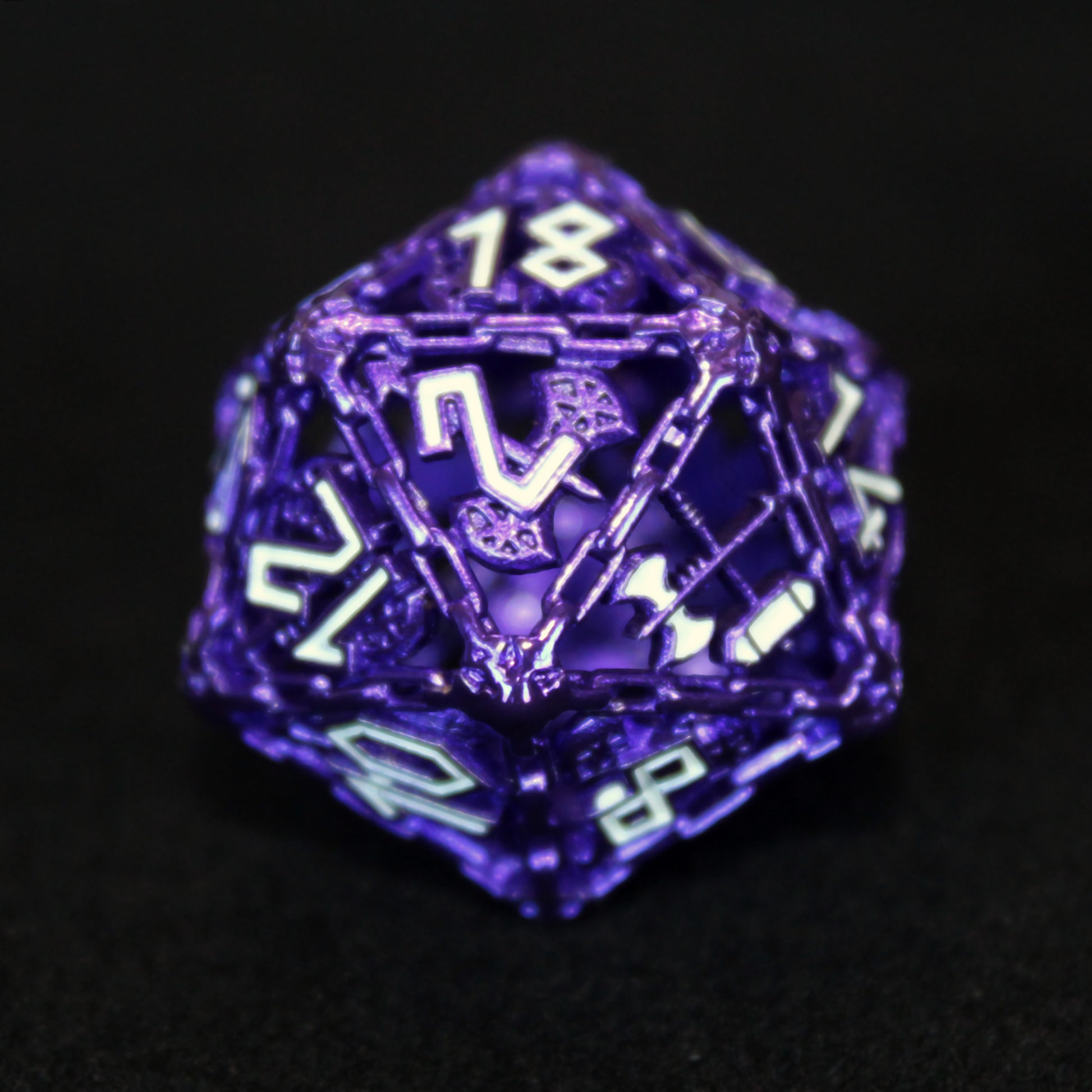 Close-up of the purple Barbarian Cage D20 with white inking, featuring the crossed war hammer and battle axe as the highest number on the die.